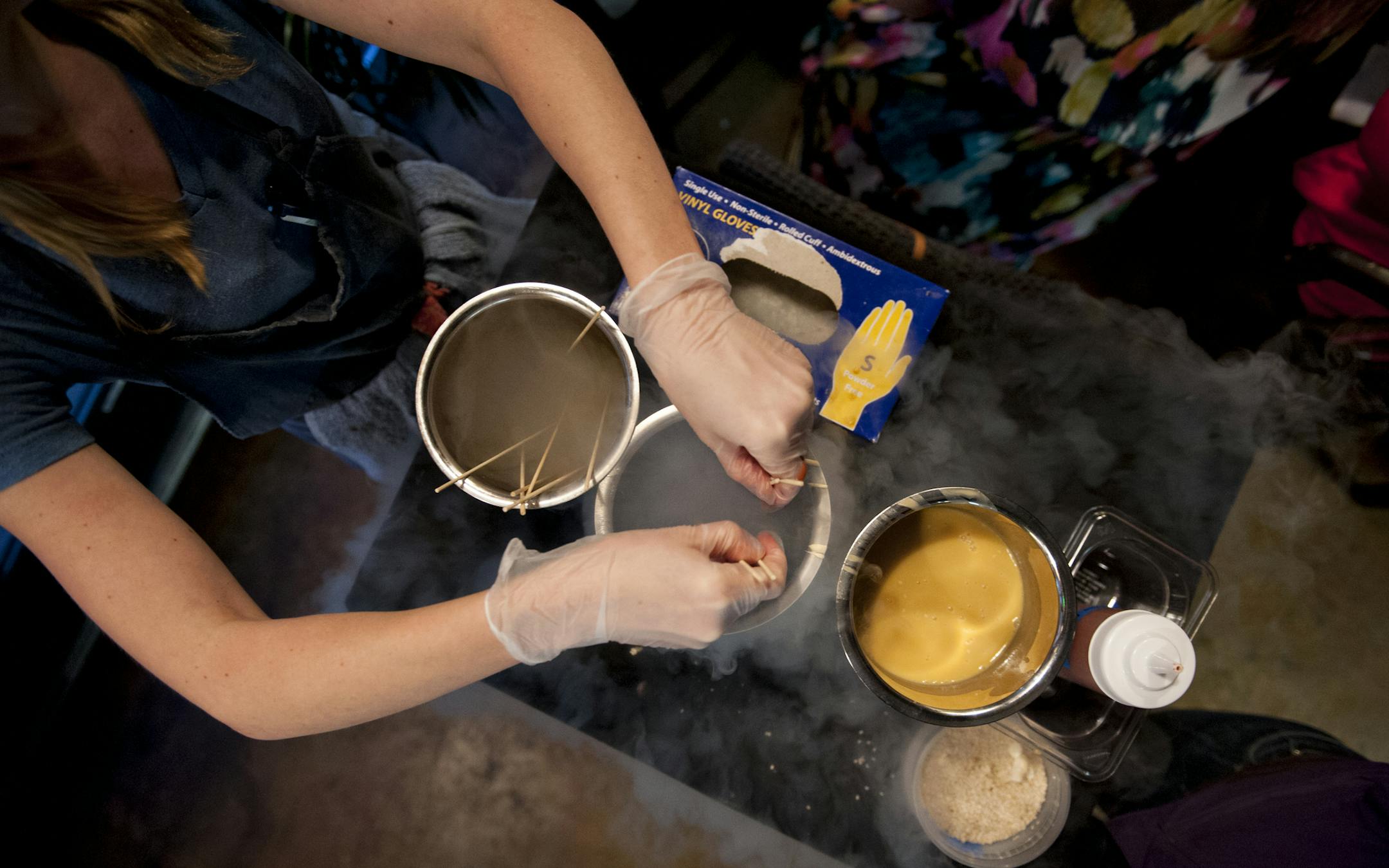 Dessert of frozen Asian Pear "popsicles" are prepared tableside at Umami. Photo by Leslie Plesser.