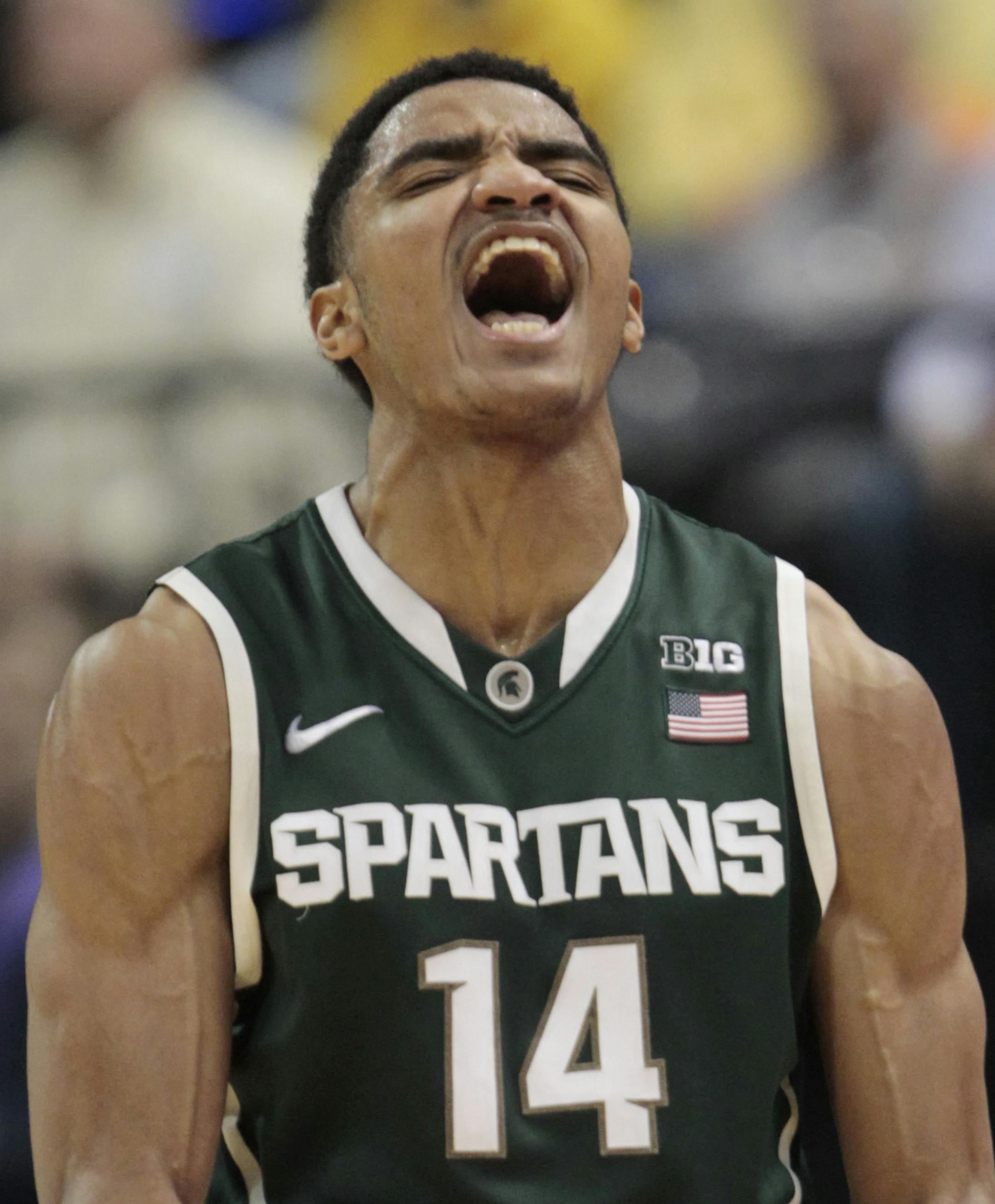 Michigan State guard Gary Harris reacts in the first half of an NCAA college basketball game against Michigan in the championship of the Big Ten Conference tournament Sunday, March 16, 2014, in Indianapolis. (AP Photo/AJ Mast)