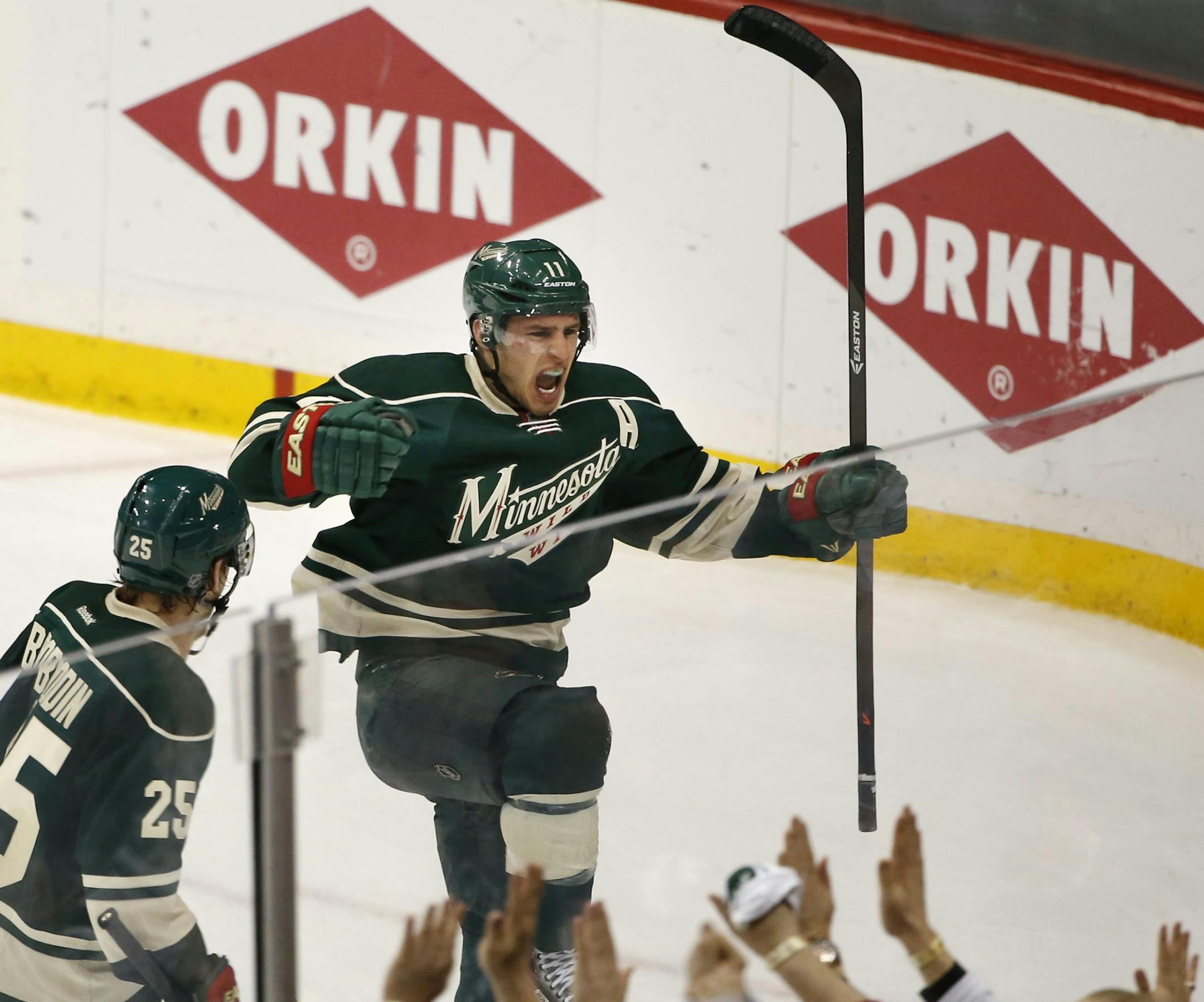 Minnesota Wild left wing Zach Parise (11) right celebrated his second goal of the night with Minnesota Wild defenseman Jonas Brodin (25) giving the Wild a 3-2 lead in the third period.] CARLOS GONZALEZ cgonzalez@startribune.com - April 28, 2014, St. Paul, Minn., Xcel Energy Center, NHL, Minnesota Wild vs. Colorado Avalanche, Stanley Cup Playoffs round 1, Game 6