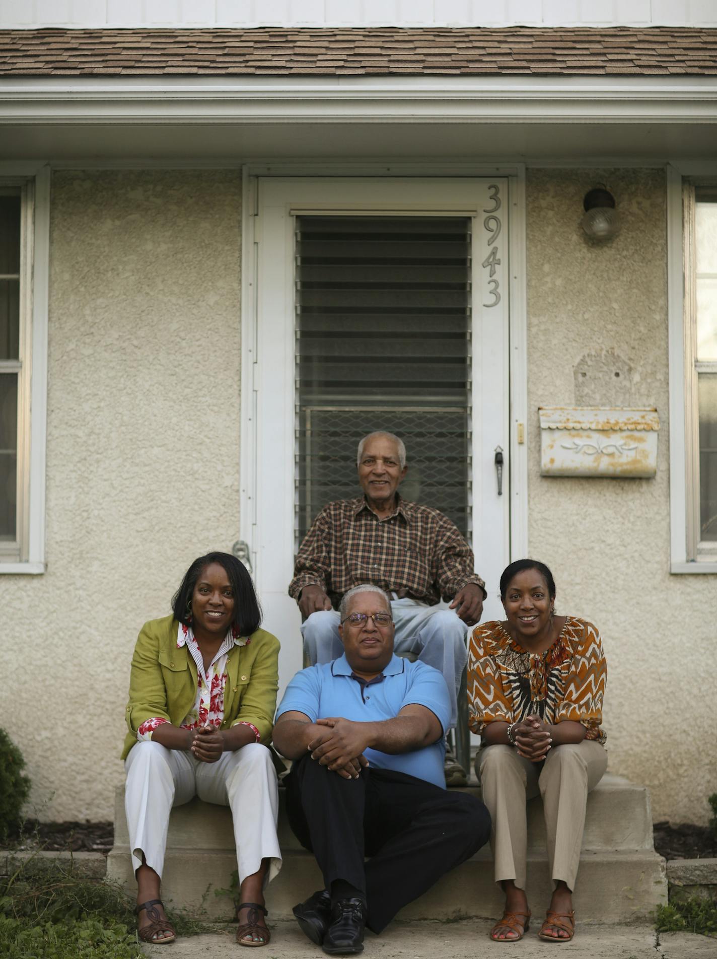 Cornelious Martin, 84, with three of his four children raised in his Tilsenbilt Home. They are, from left, Kelly, Craig and Karen Martin.