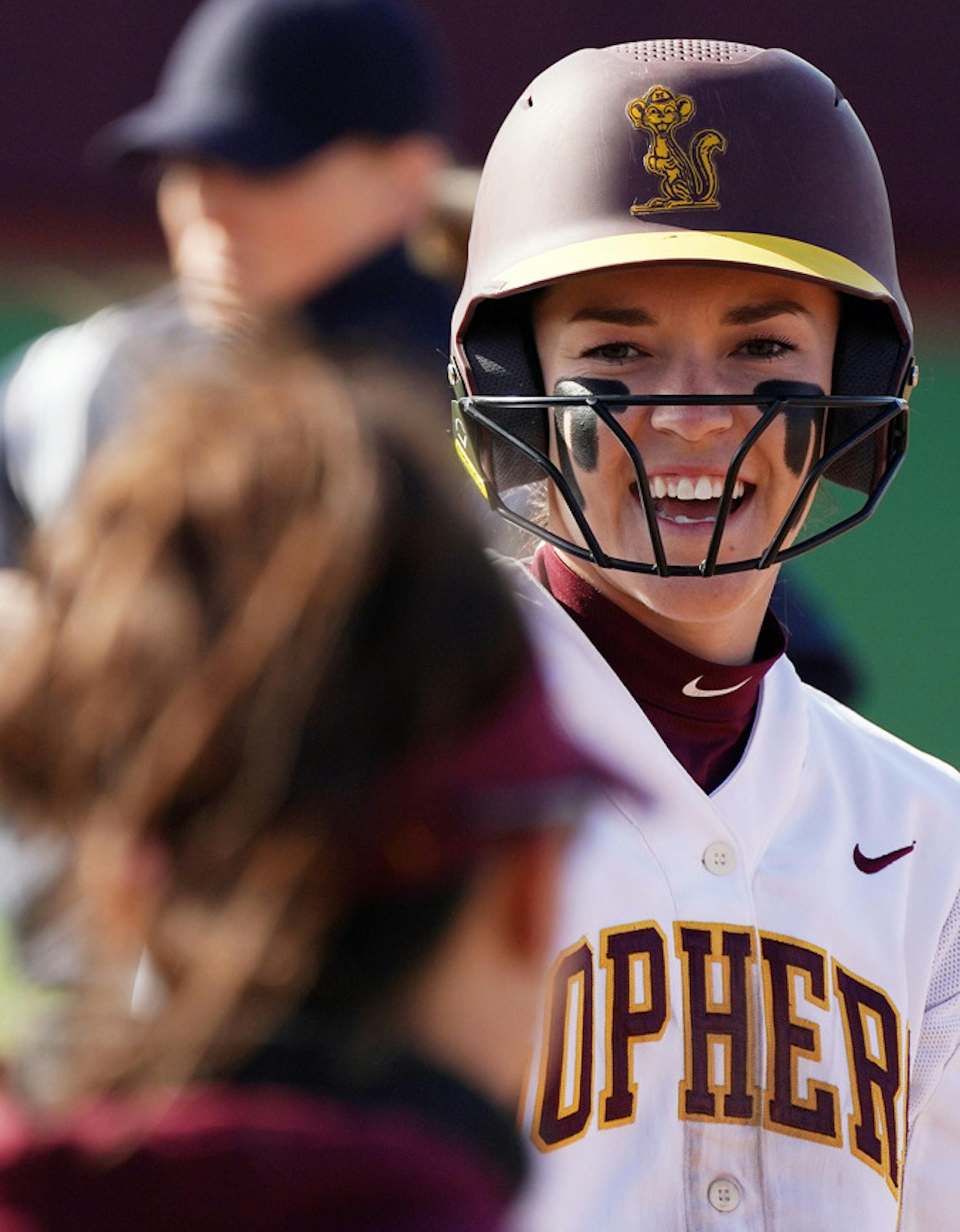 Gophers' second baseman MaKenna Partain (3) joked with her third base coach after getting a hit. ] ANTHONY SOUFFLE • anthony.souffle@startribune.com The Minnesota Golden Gophers softball team played Iowa in a doubleheader Friday, April 26, 2019 at Jane Sage Coweles Stadium in Minneapolis. ORG XMIT: MIN1905011300342046