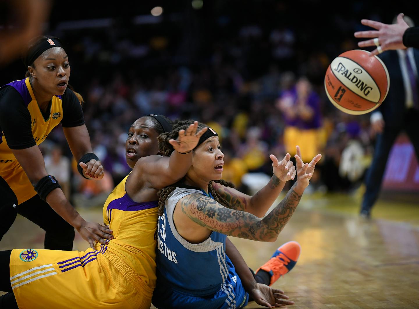 Seimone Augustus (33) passed the ball while being defended by Los Angeles Sparks guard Chelsea Gray