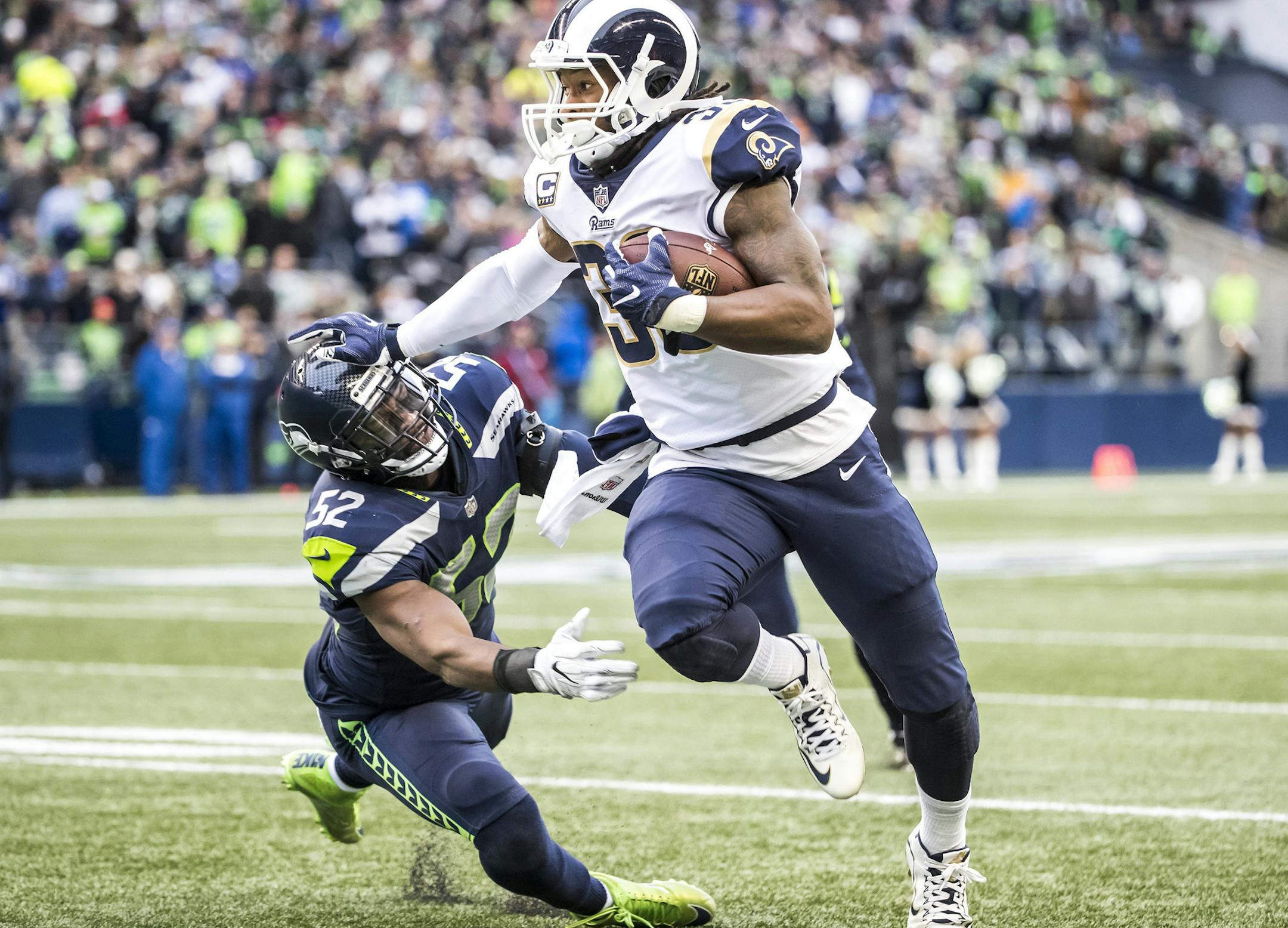 Los Angeles Rams running back Todd Gurley stiff-arms Seattle Seahawks outside linebacker Terence Garvin in the second quarter on Sunday, Dec. 17, 2017 at CenturyLink Field in Seattle, Wash. (Bettina Hansen/Seattle Times/TNS) ORG XMIT: 1219410