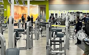 Police put up caution tape following gunfire inside the LA Fitness gym in Edina.