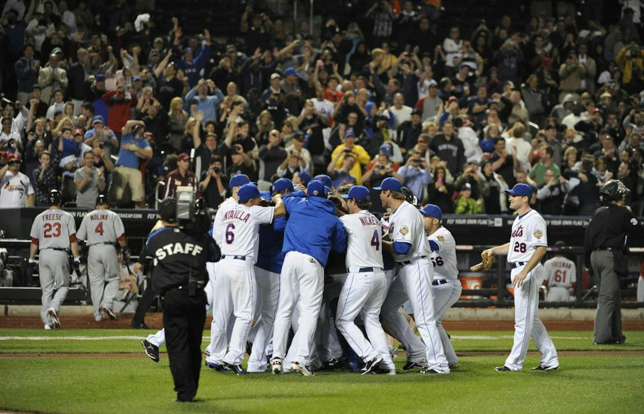 New York Mets surround starting pitcher Johan Santana after he threw a no-hitter against the St. Louis Cardinals.