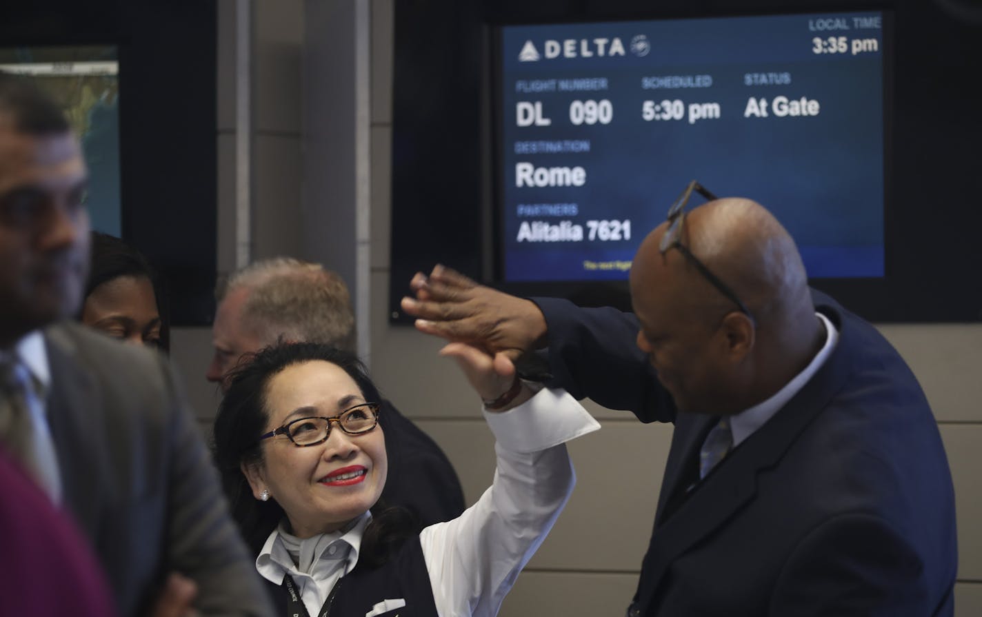 The start of Delta&#x2019;s MSP-to-Rome service was cause for gate agents Song Schuler and Mauricio Clarke to high-five each other.