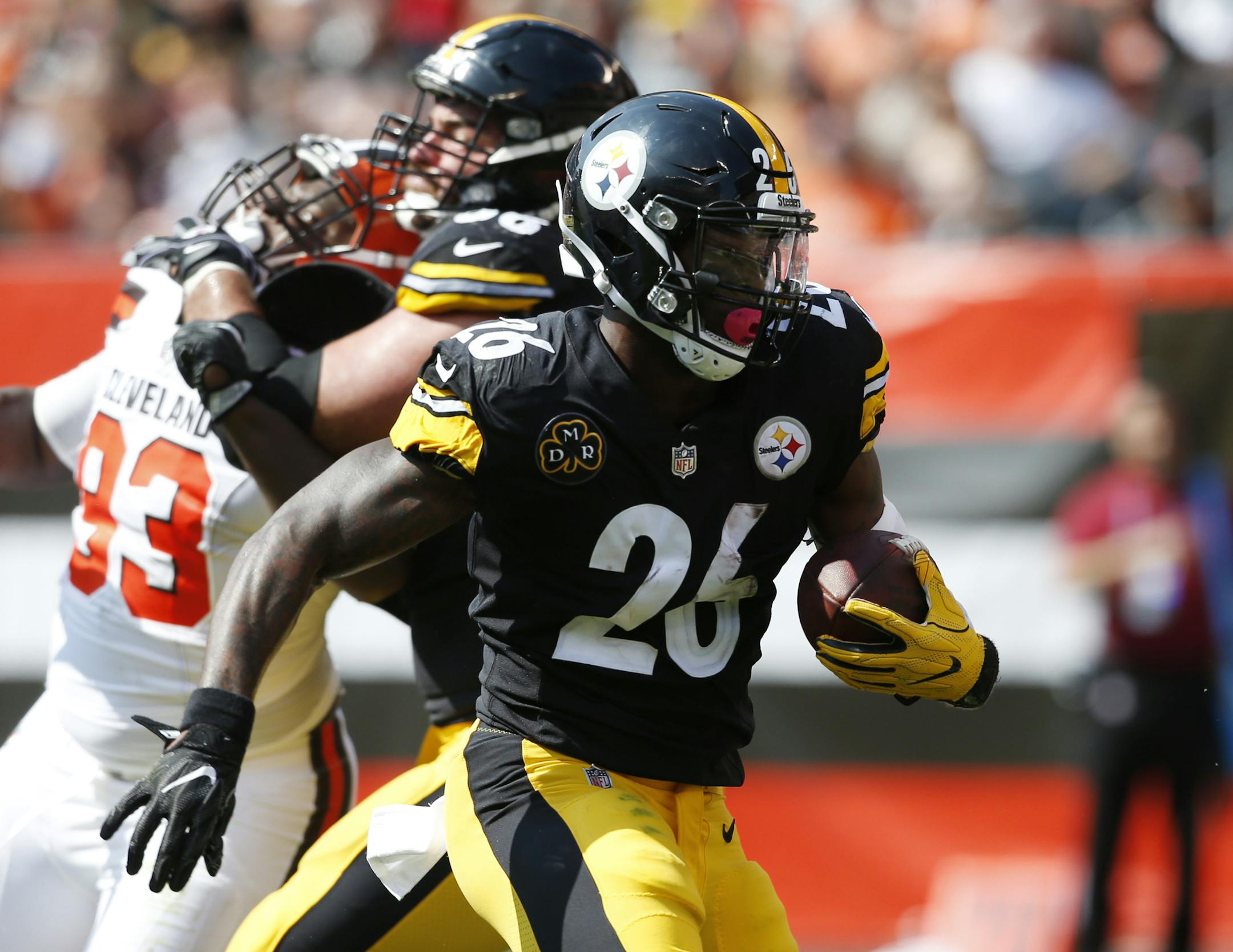 FILE - In this Sunday, Sept. 10, 2017 file photo, Pittsburgh Steelers running back Le'Veon Bell (26) runs with the ball during the second half of an NFL football game against the Cleveland Browns in Cleveland. Pittsburgh Steelers running back Le’Veon Bell is trying to stay upbeat after a slow start. Bell finished with just 47 total yards in a Week 1 victory over Cleveland, the lowest total for a game he’s started and finished in his four-year career.(AP Photo/Ron Schwane, File)