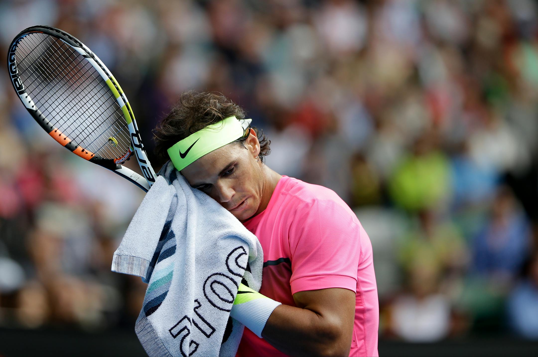 Rafael Nadal of Spain wipes the sweat from the face during his loss to Tomas Berdych of the Czech Republic in the Australian Open quarterfinals on Tuesday.