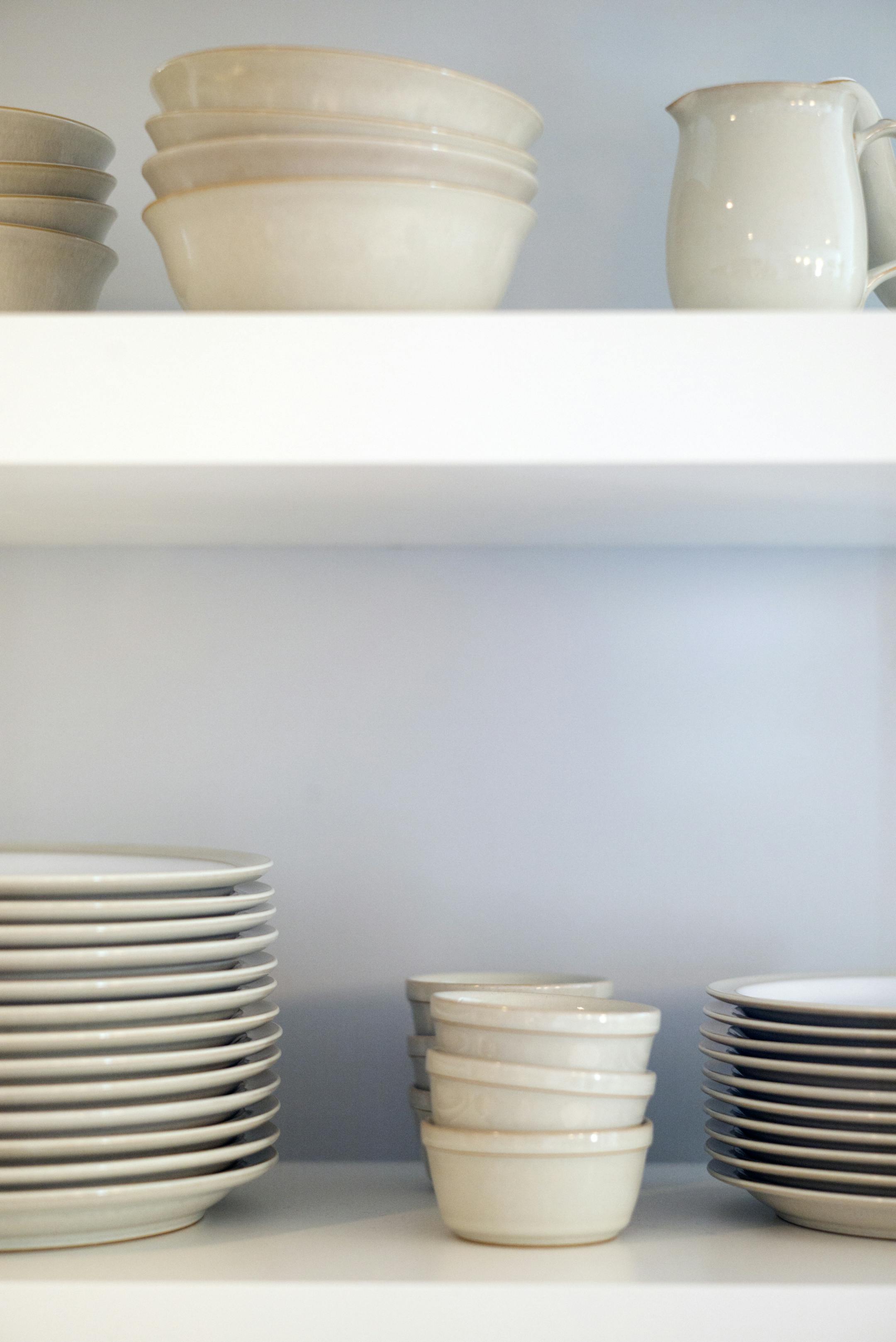 Angela and Ricky Brown show off their remodeled home, the one Ricky grew up in. Open shelves serve as easy to access storage for dishes.]Richard Tsong-Taatarii/rtsong-taatarii@startribune.com