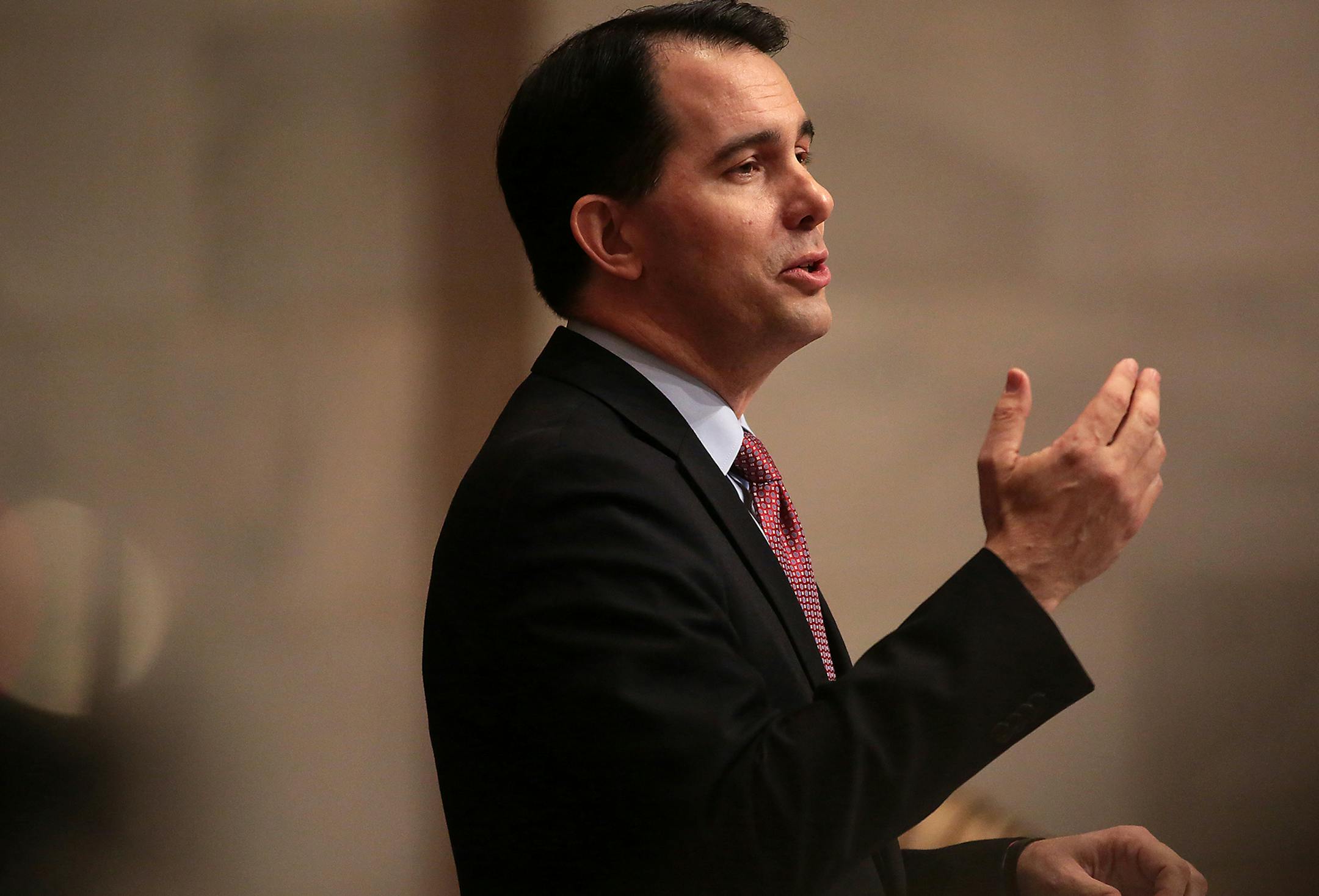 Wisconsin Gov. Scott Walker delivers his state budget address at the Wisconsin state Capitol in Madison, Wis. Tuesday, Feb. 3, 2015. (AP Photo/Wisconsin State Journal, John Hart) ORG XMIT: MIN2015021014325485