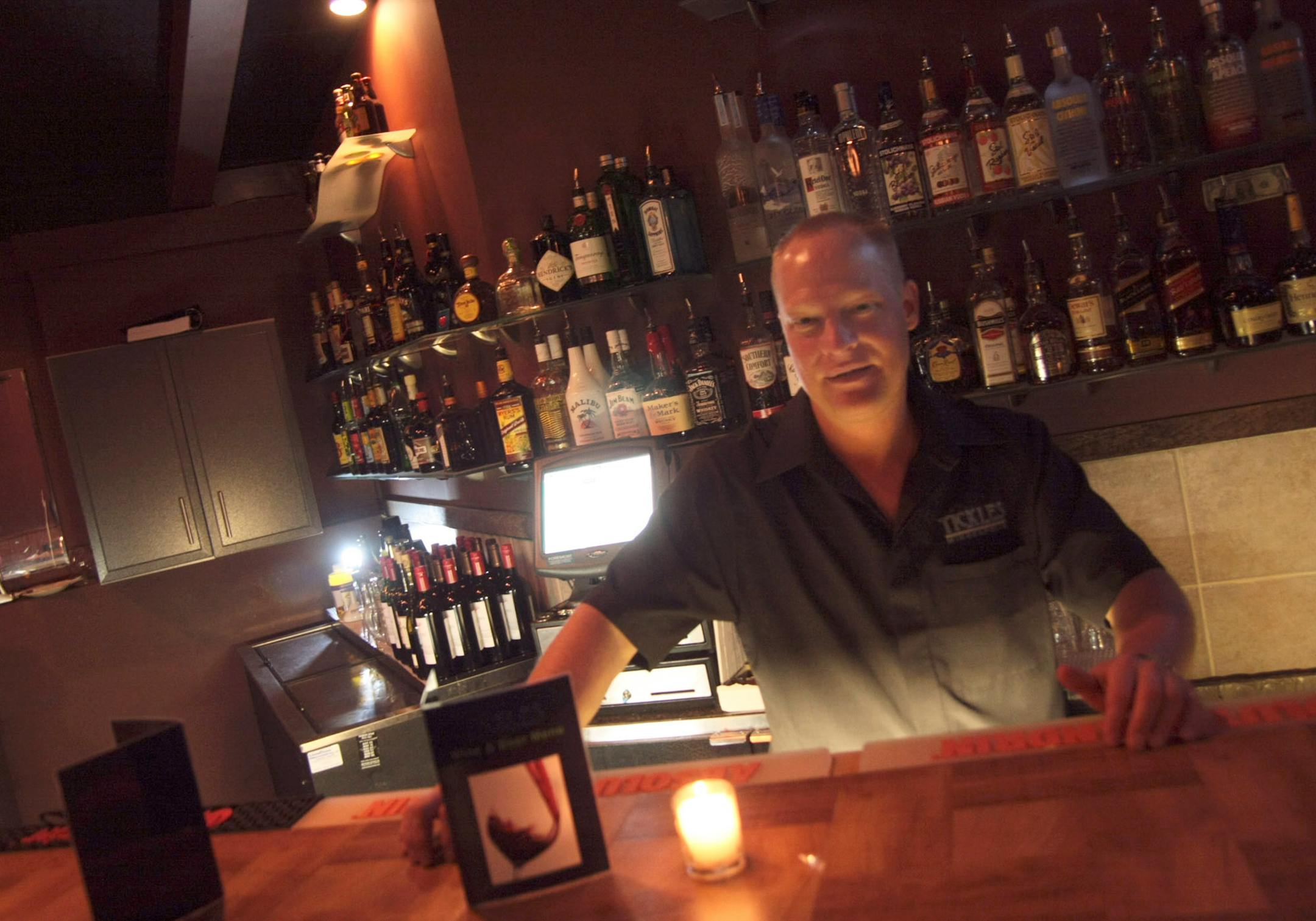 Joel Janssen is the general manager at the Twin Cities' latest gay bar, Tickles, which features a rare concept — it's half piano bar/ half sports bar.