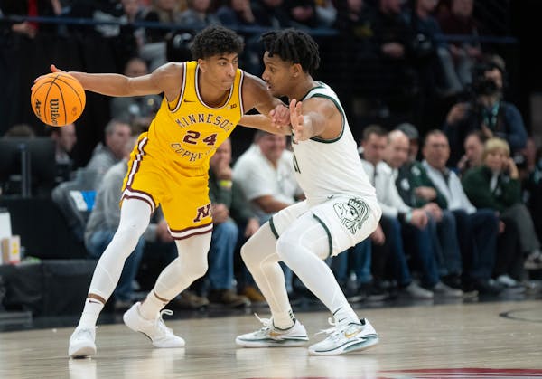 Gophers guard Cam Christie (24) averaged 11.3 points per game and made the Big Ten's All-Freshman team this season, but he is considering his pro opti