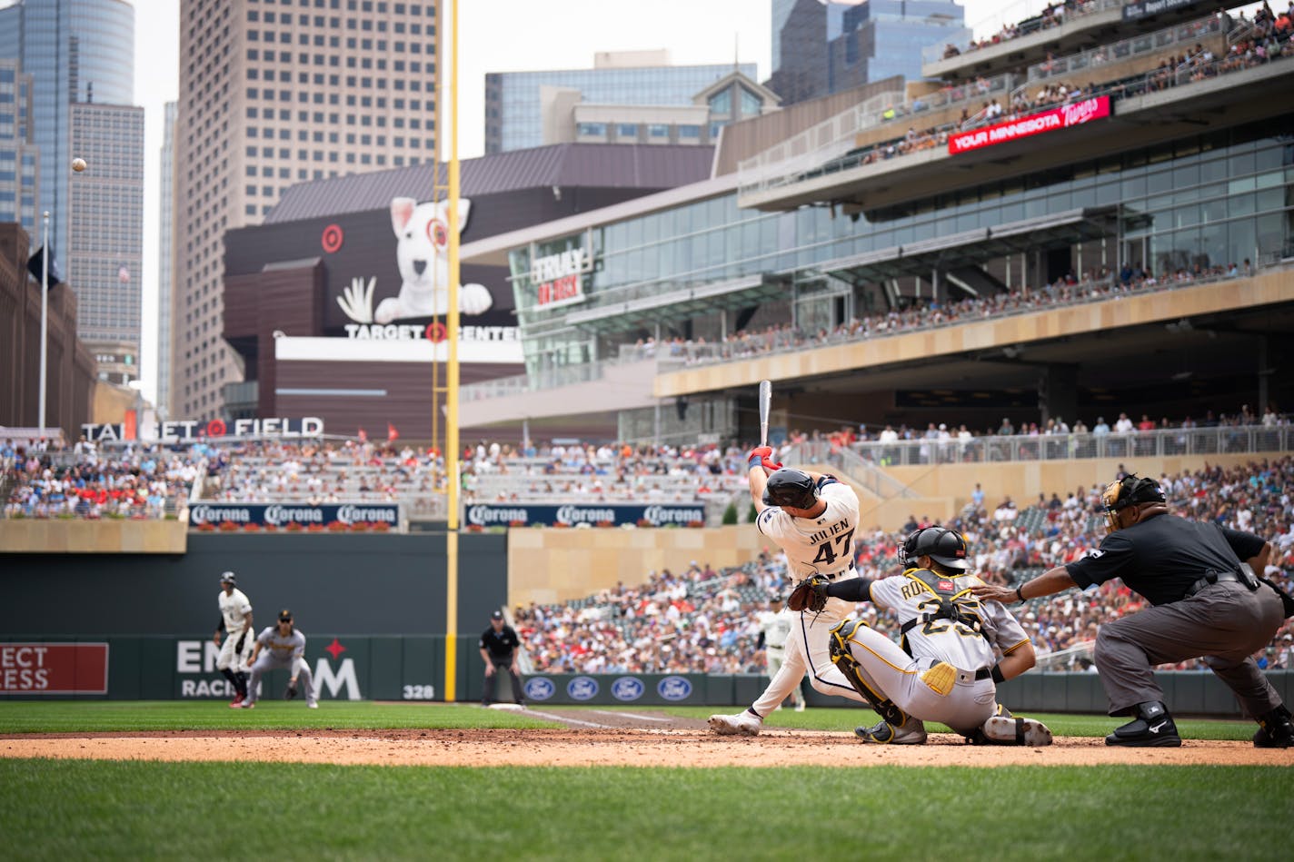 Minnesota Twins second baseman Edouard Julien (47) hit a sacrifice fly ball in the fourth inning scoring first baseman Donovan Solano (39) at Target Field Sunday August 12,2023 in Minneapolis.,Minn. ] JERRY HOLT • jerry.holt@startribune.com