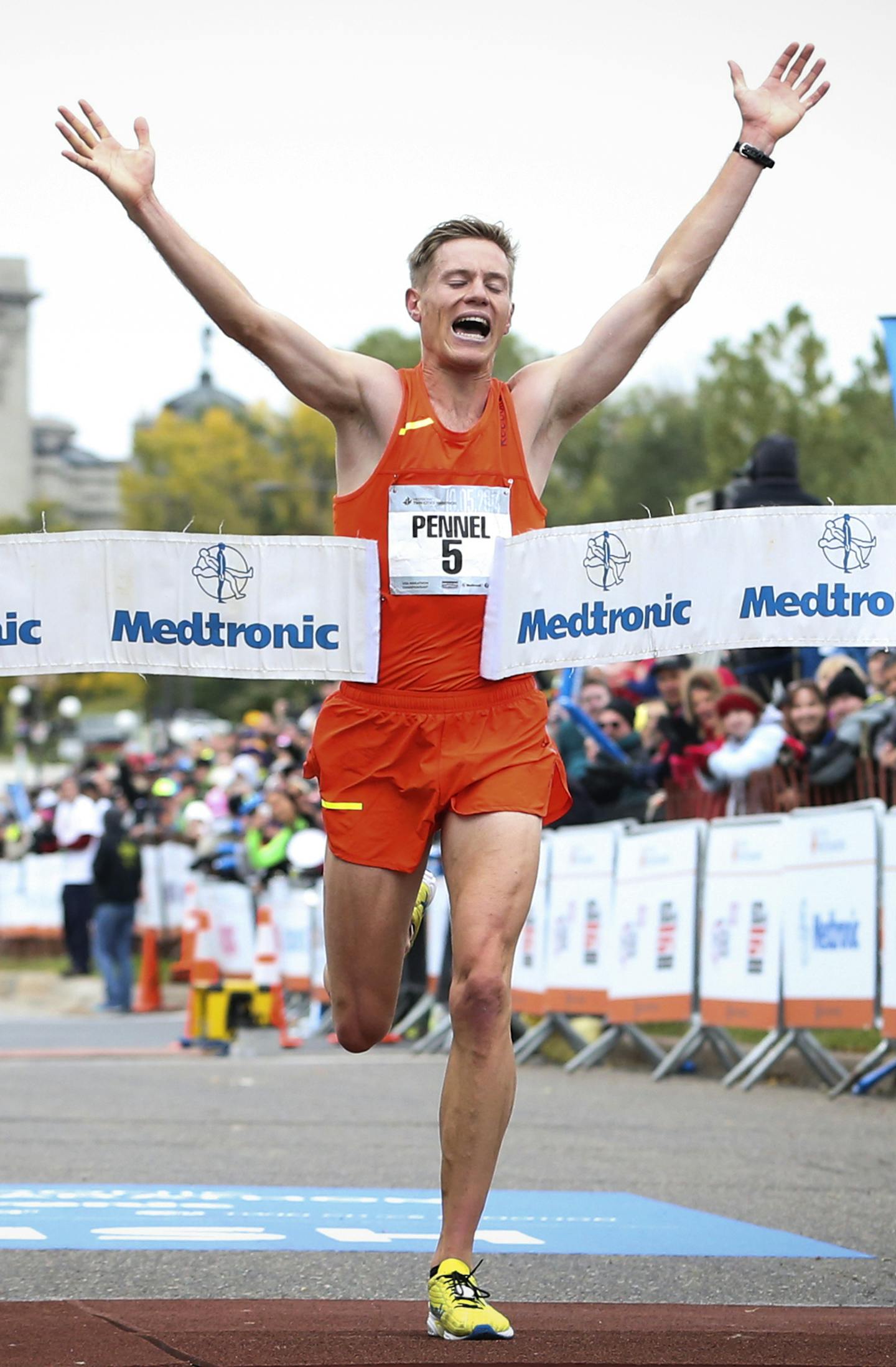 Men's marathon winner Tyler Pennel crossed the finish line of the 2014 Medtronic Twin Cities Marathon on Sunday, October 5, 2014 in St. Paul, Minn. ] RENEE JONES SCHNEIDER &#xef; reneejones@startribune.com ORG XMIT: MIN1410051103401102