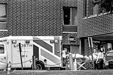 An ambulance from North Memorial drops off a patient at North Ridge Health and Rehab. Michael and Kathy Johnson felt lucky to be alive when they moved