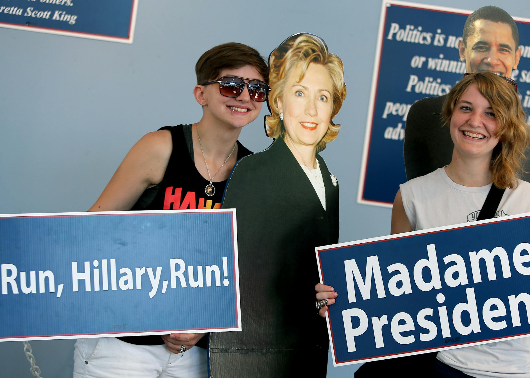Sisters Arielle Mathre, left, and Grace Mathre, of Maple Grove, were happy to pose for photos with cutouts of Hillary Clinton and President Barack Obama in the Democratic Headquarters at the Minnesota State Fair, Friday, August 23, 2013 in Falcon Heights, MN> (ELIZABETH FLORES/STAR TRIBUNE) ELIZABETH FLORES • eflores@startribune.com