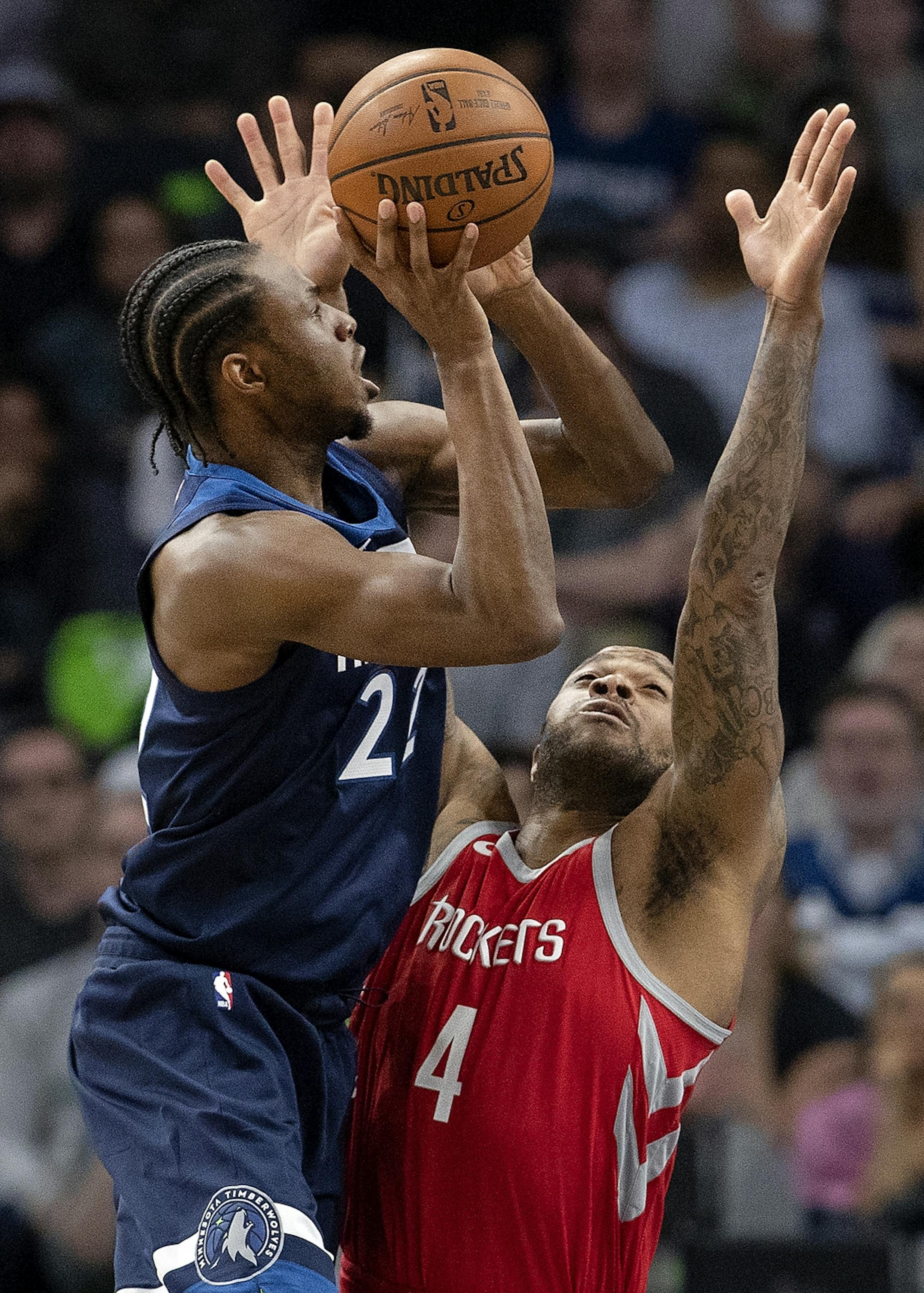 Minnesota Timberwolves Andrew Wiggins (22) was defended by P.J. Tucker (4) in the third quarter.