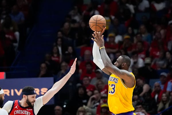 Lakers forward LeBron James (23) shoots against Pelicans forward Larry Nance Jr. in the second half of an NBA play-in tournament game Tuesday in New O