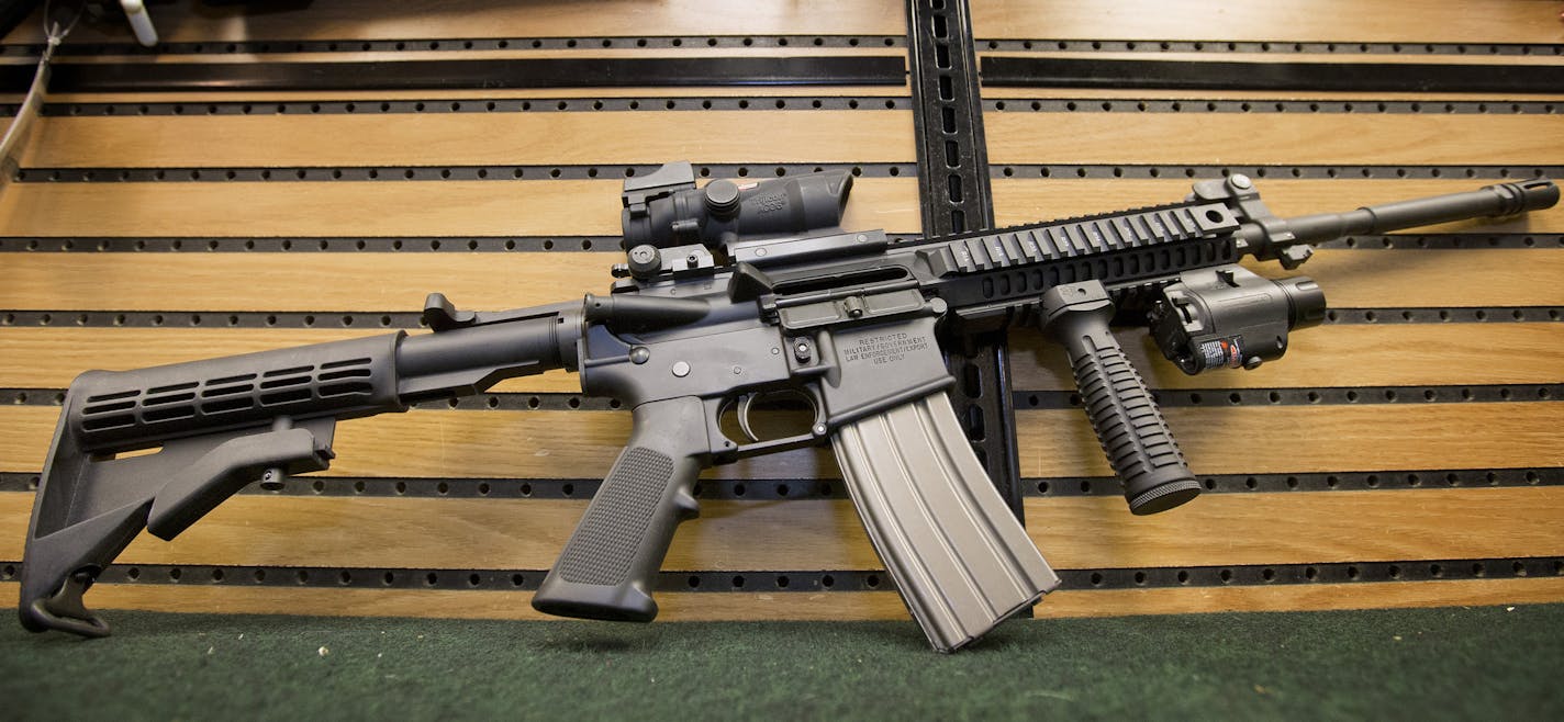 The Colt AR-15 semi-automatic rifle on display at Joe's Sporting Goods - Ski Shop, Inc. in St. Paul. ] CARLOS GONZALEZ cgonzalez@startribune.com - December 18, 2012, St. Paul, Minn., Joe's Sporting Goods, story about gun sales, particularly AR-15 or that style rifle.