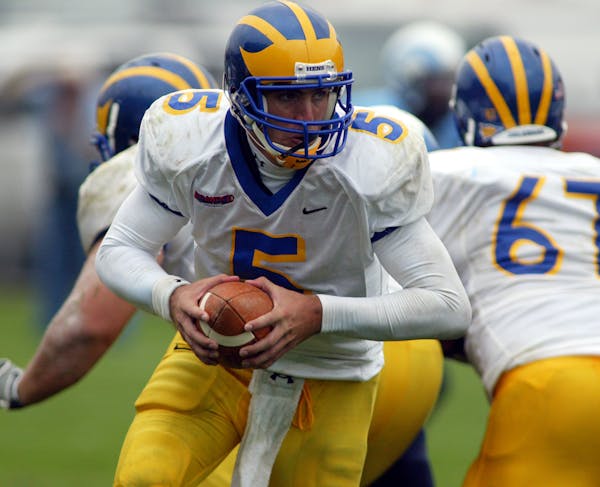 Delaware quarterback Joe Flacco (5) looks to hand off during a college football game against Rhode Island in South Kingstown, R.I. on Saturday, Sept. 