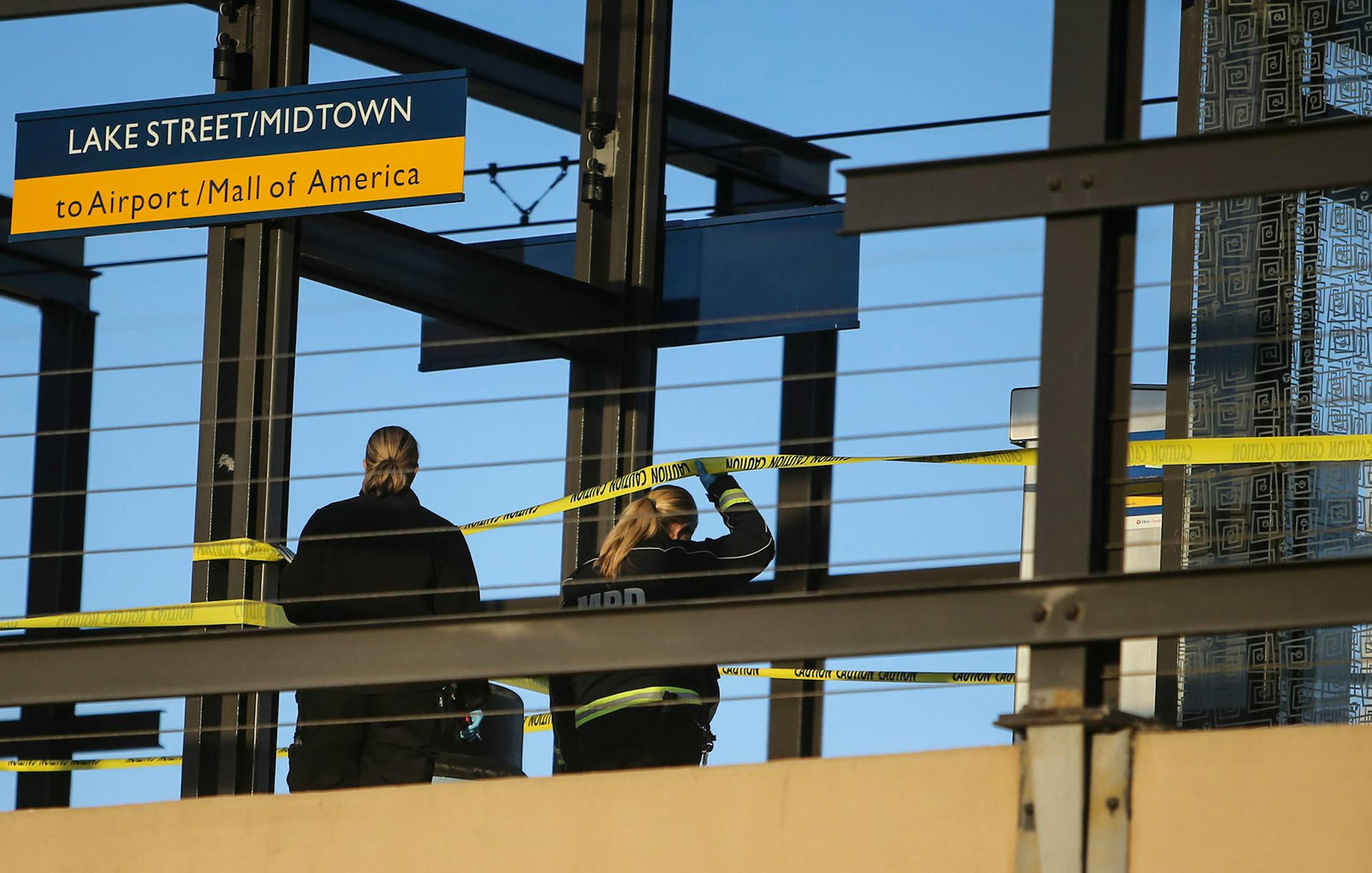 Police investigators went over the scene of a fatal stabbing on the Midtown Lake Street light rail platform that shut down the station for a time Saturday afternoon.