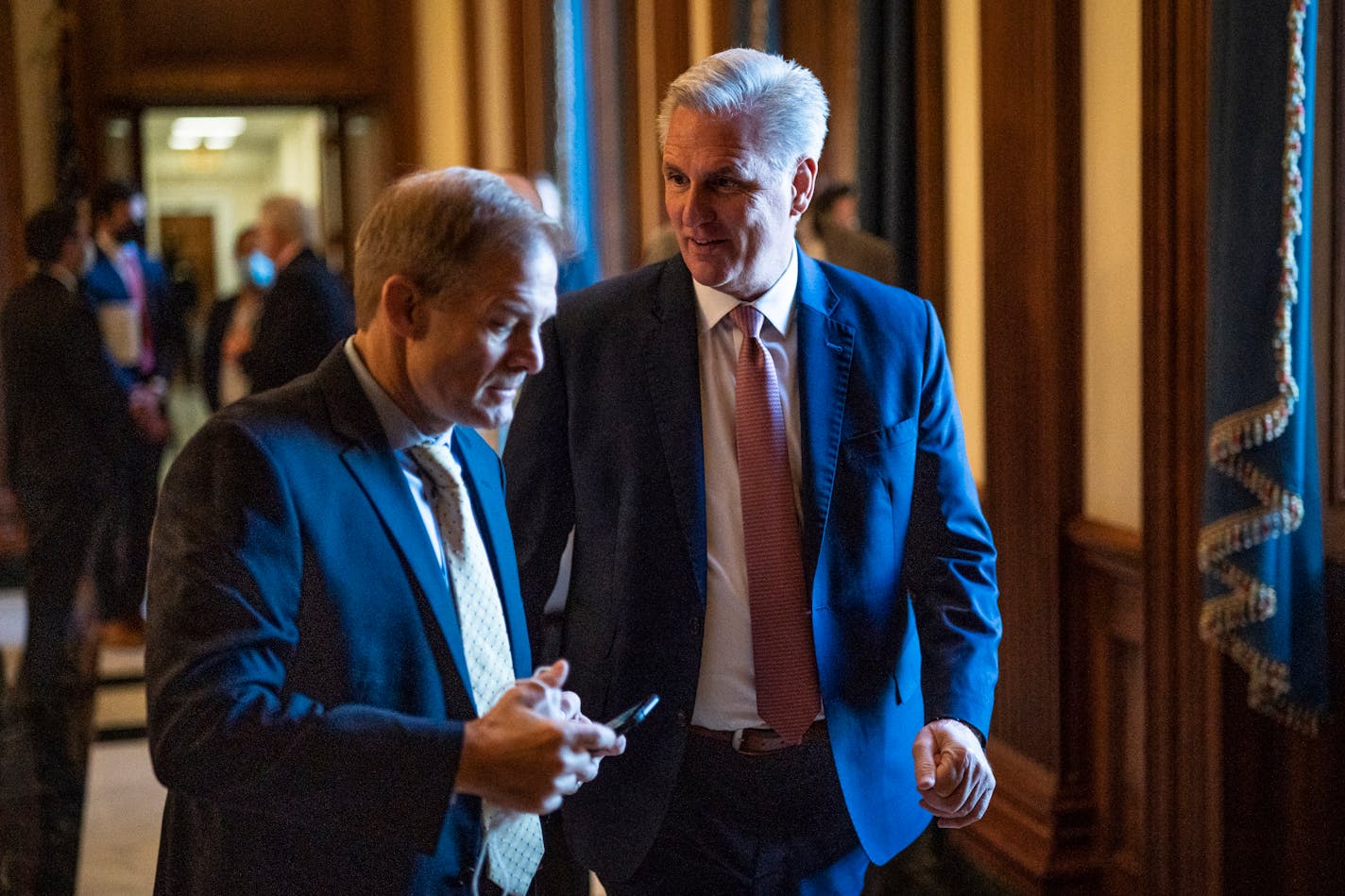 House Minority Leader Kevin McCarthy (R-Calif.) speaks with Rep. Jim Jordan (R-Ohio) as they walk to a news conference about the Biden agenda on Capitol Hill on Nov. 17, 2021. MUST CREDIT: Washington Post photo by Jabin Botsford.