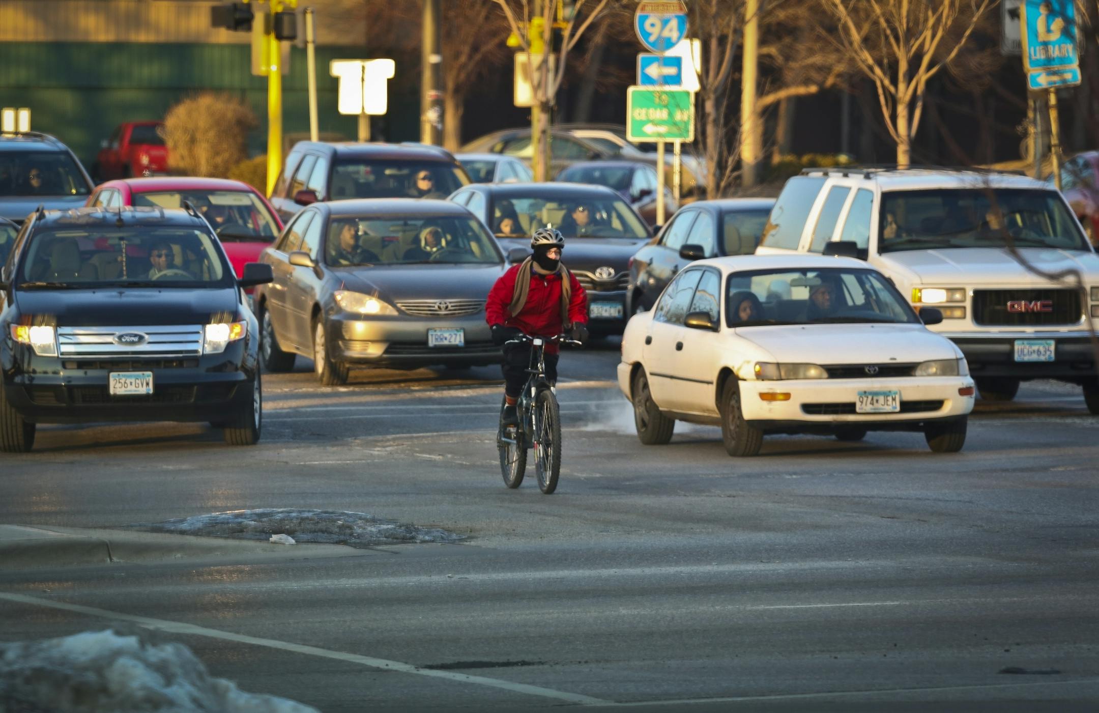 Bicyclists crossed Cedar Avenue and East Franklin Avenue in traffic on Tuesday, January 15, 2013, in Minneapolis, Minn. This intersection has had 20 bicycle/car crashes in the last ten years.