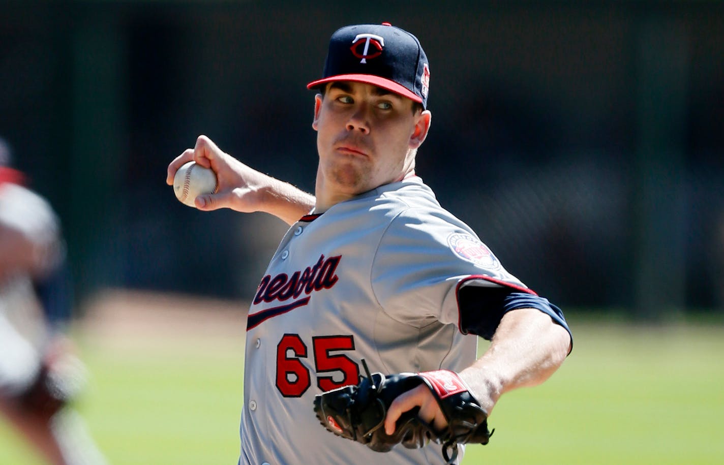 Minnesota Twins starting pitcher Trevor May delivers against the Chicago White Sox during the first inning of a baseball game Sunday, Sept. 14, 2014, in Chicago. (AP Photo/Andrew A. Nelles)