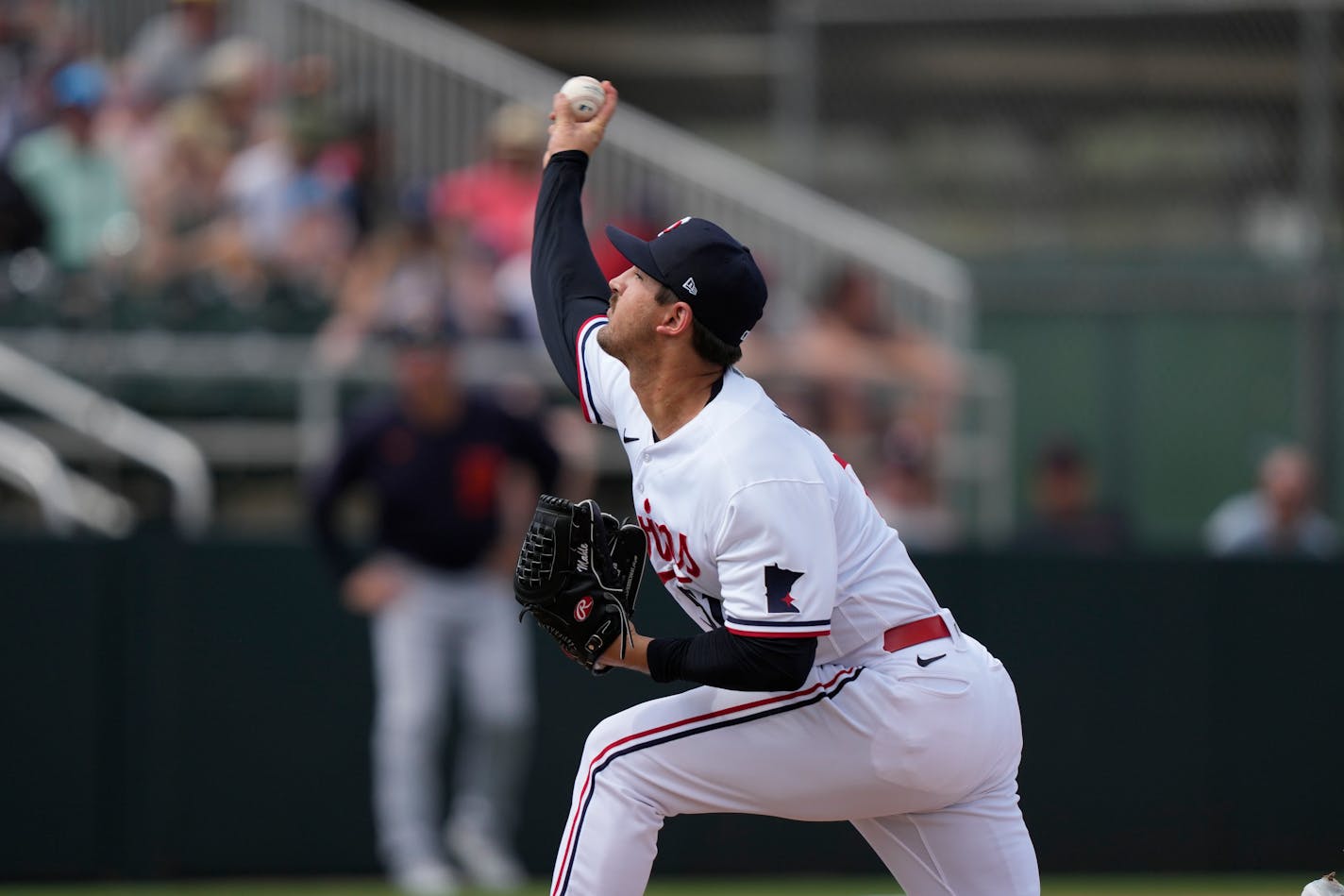 Minnesota Twins pitcher Tyler Mahle (51) throws in the fifth inning of a spring training baseball game against the Detroit Tigers in Fort Myers, Fla., Sunday, March 5, 2023. (AP Photo/Gerald Herbert)