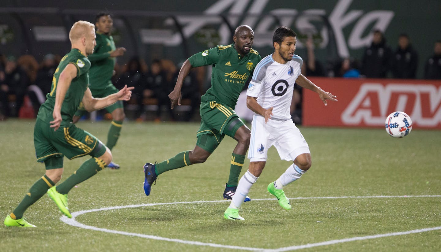 Minnesota United midfielder Johan Venegas (11) drives toward the goal in the first half against the Portland Timbers in Portland, Ore., Mar. 3, 2017. (AP Photo/Randy L. Rasmussen) ORG XMIT: ORRR101