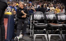 Wolves coach Chris Finch sat on the bench before the start of Game 1 vs. the Nuggets on Saturday in Denver.