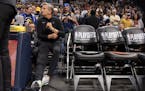 Timberwolves coach Chris Finch sat down before Saturday's game in Denver. Finch had knee surgery on Wednesday and spent Saturday as an advisor to lead