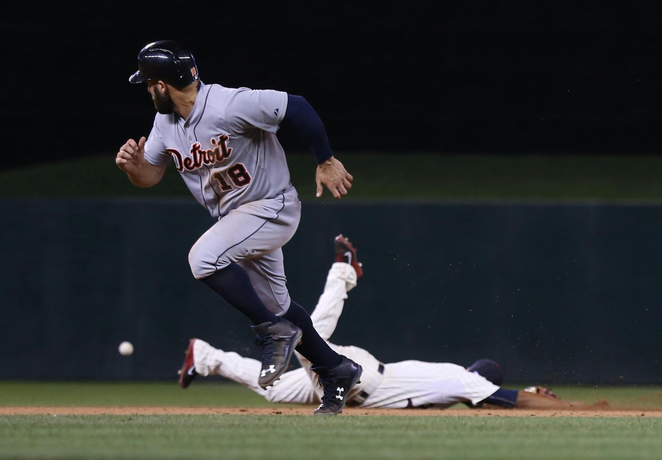 Tyler Collins watched the ball go passed the Twins' Eduardo Escobar. Detroit went ahead in the ninth inning on the play.
