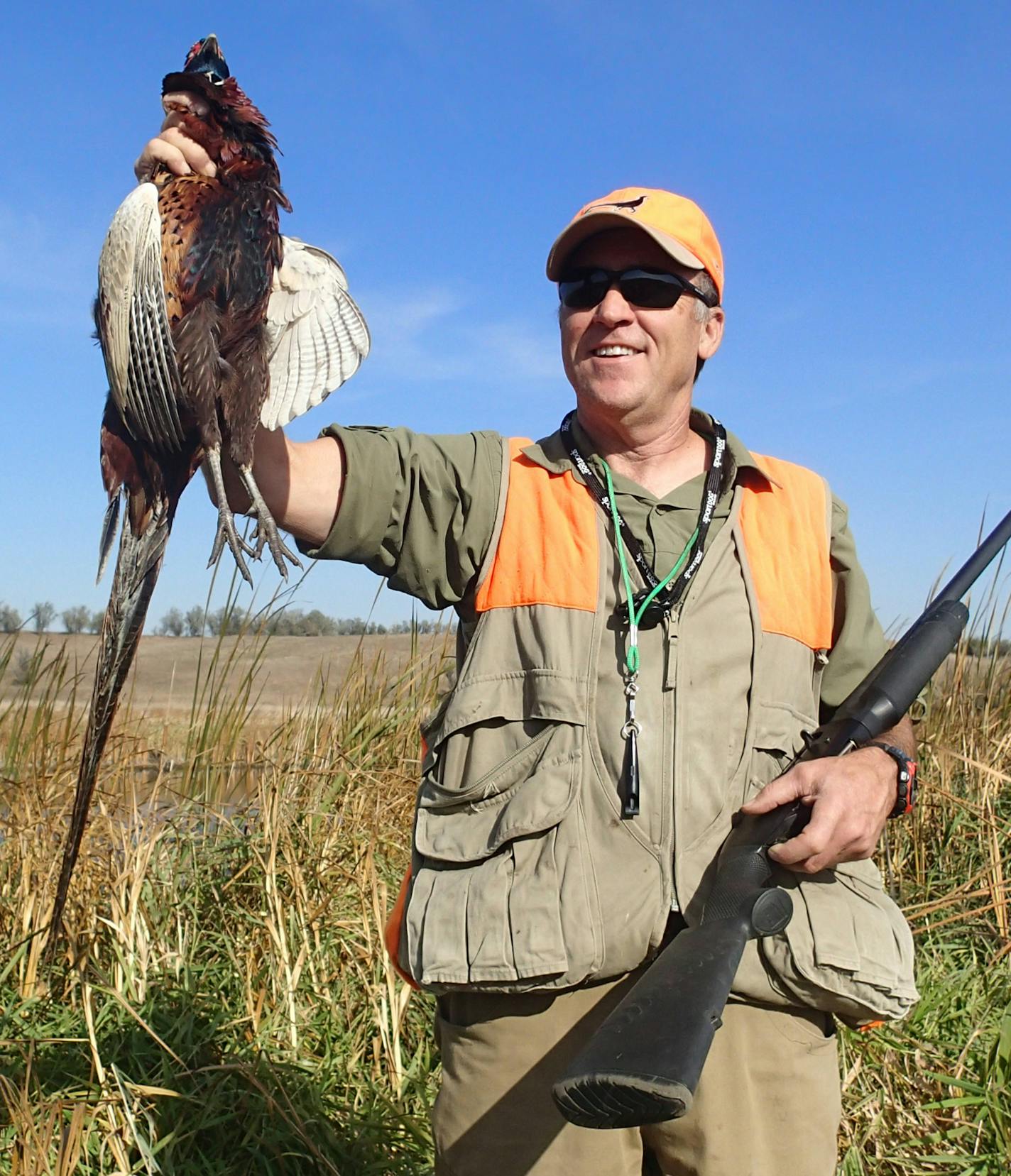 McMullen holds a pheasant bagged during a South Dakota hunt on Monday.