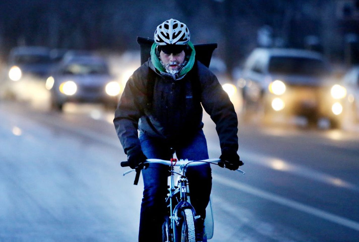 A bike commuter had a frosted beard while commuting into downtown Minneapolis, MN, Tuesday, Jan. 12,2015.