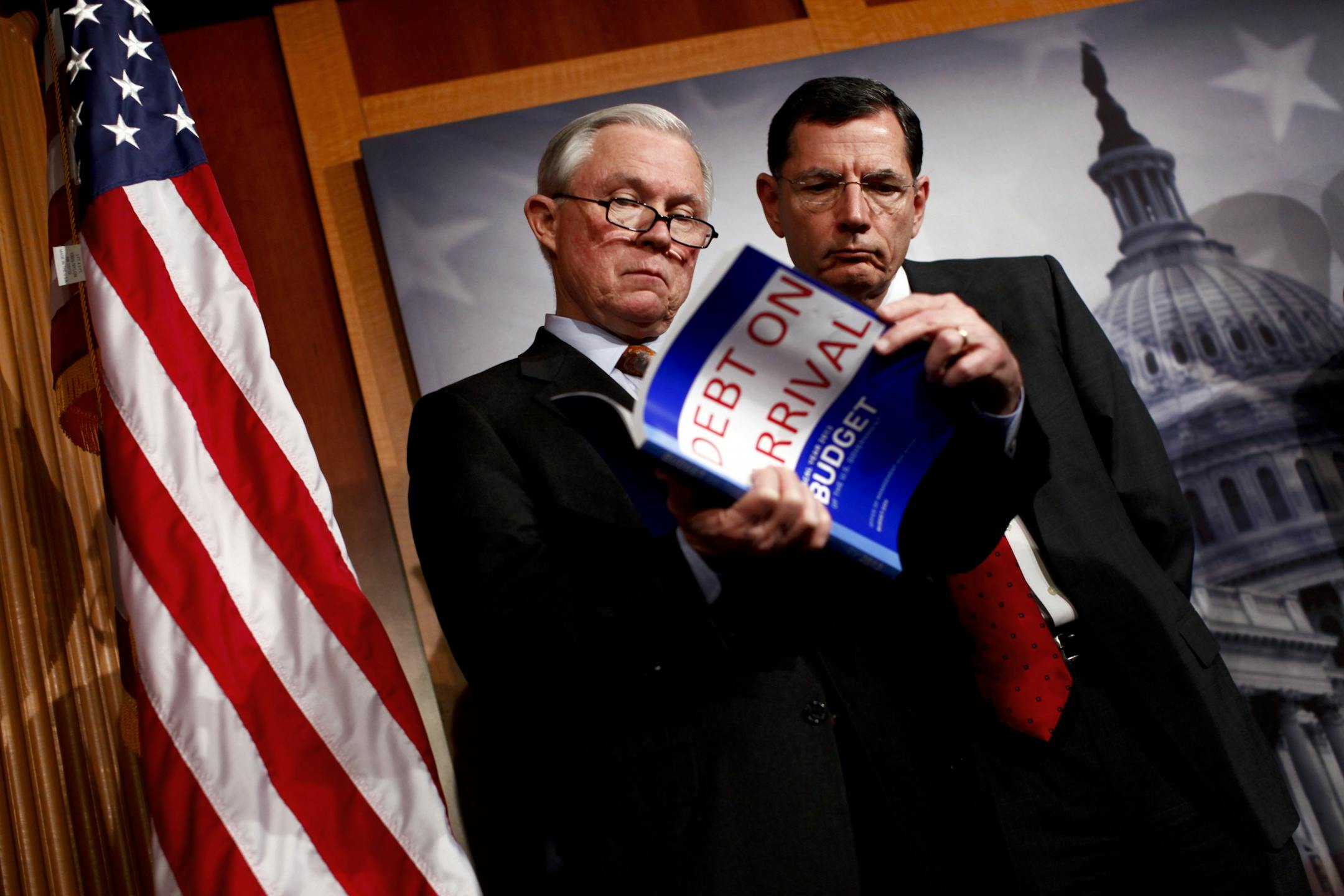 Sen. Jeff Sessions (R-Ala.) and Sen. John Barrasso (R-Wyo.) look at a copy of the 2013 budget.
