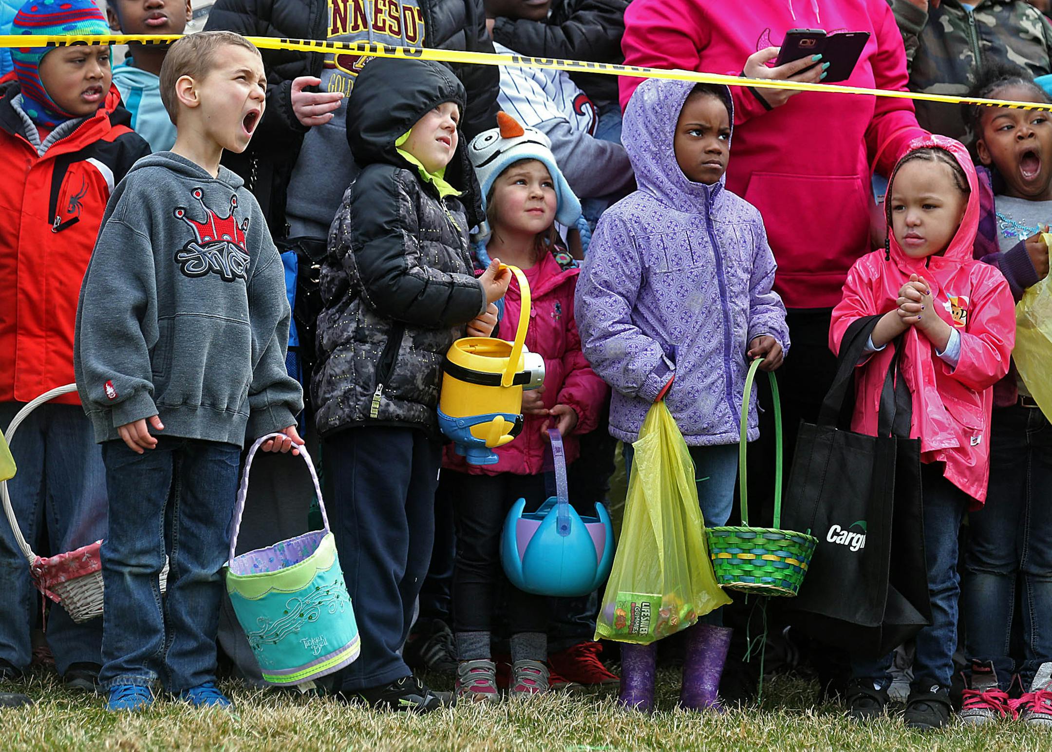 Children waited patiently for the helicopter to arrive and for the egg drop to begin.] JIM GEHRZ ï james.gehrz@startribune.com /Minneapolis, MN / March 26, 2016 1:00 PM - BACKGROUND INFORMATION: EggStravaganza Helicopter Egg Drop. Rather than your usual Easter egg hunt, this one involves eggs being dropped from a helicopter, and kids running around mad picking them up.
