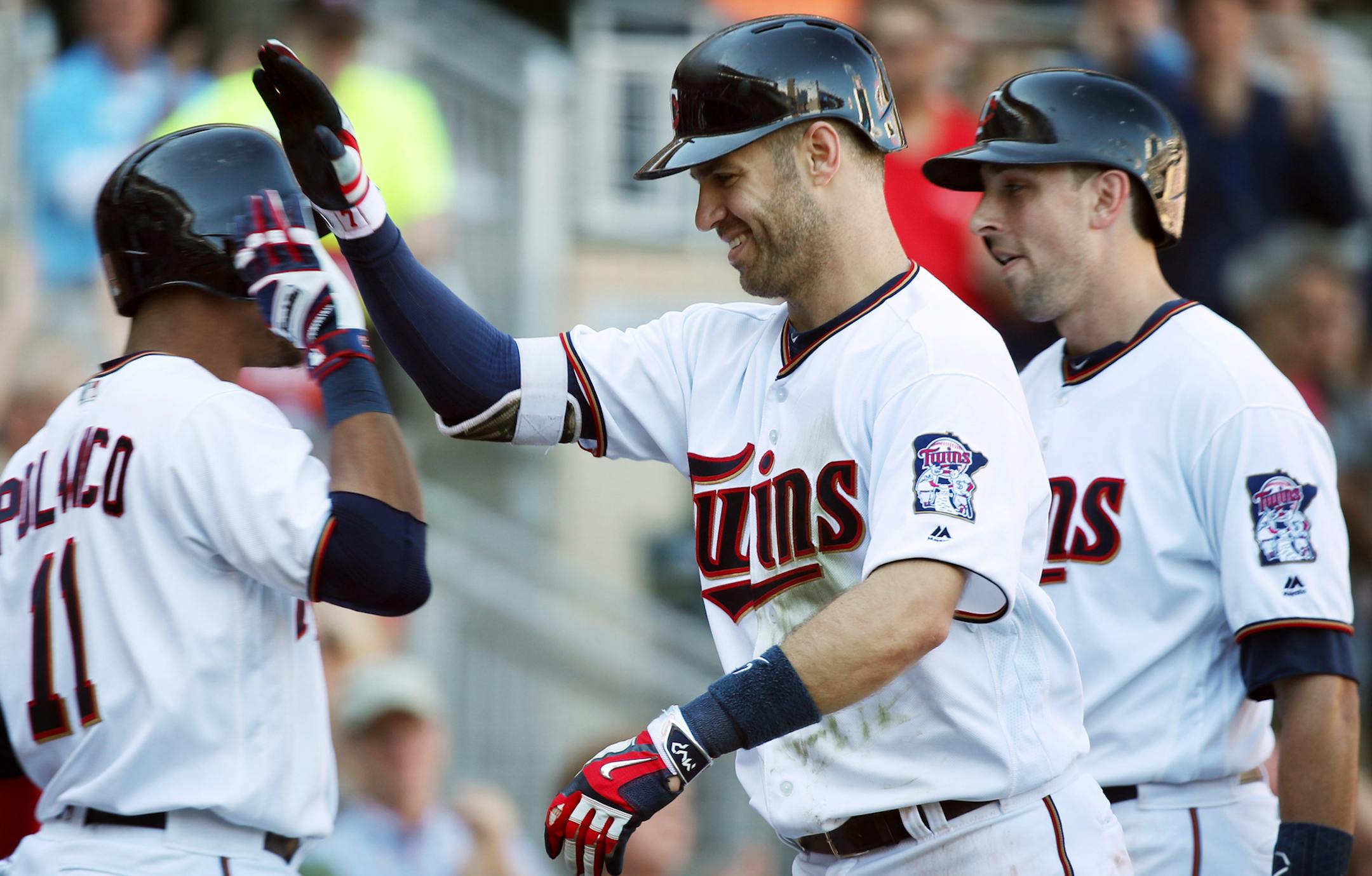 Minnesota Twins first baseman Joe Mauer (7) celebrated his grand slam with Jorge Polanco in the fifth inning at Target Field Sunday September 17,2017 in Minneapolis, MN. ] JERRY HOLT &#xef; jerry.holt@startribune.com