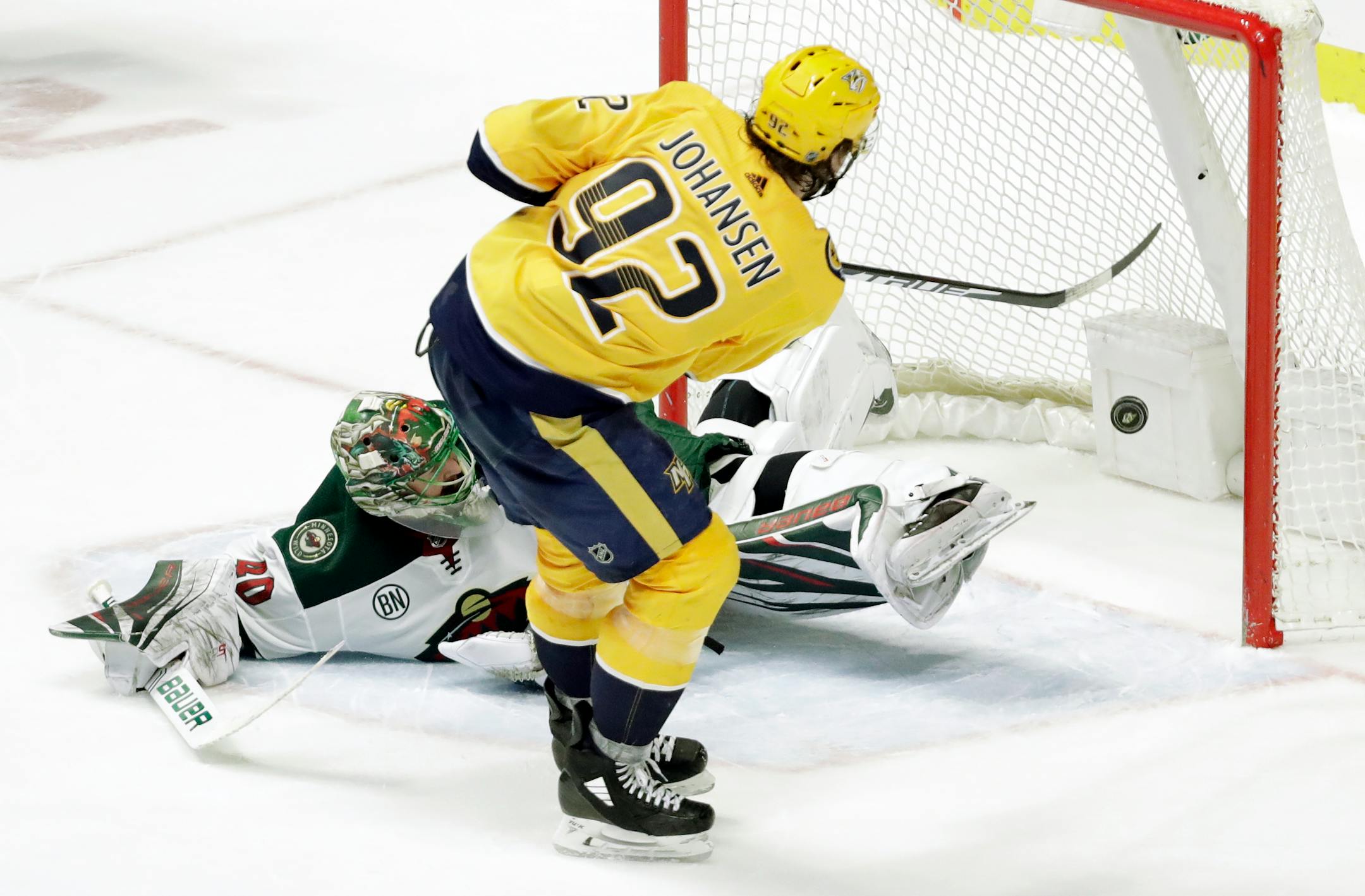 Predators center Ryan Johansen scores the winning goal against Wild goaltender Devan Dubnyk during the shootout