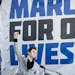 David Hogg, a survivor of the mass shooting at Marjory Stoneman Douglas High School, raises his fist after speaking during the "March for Our Lives" r