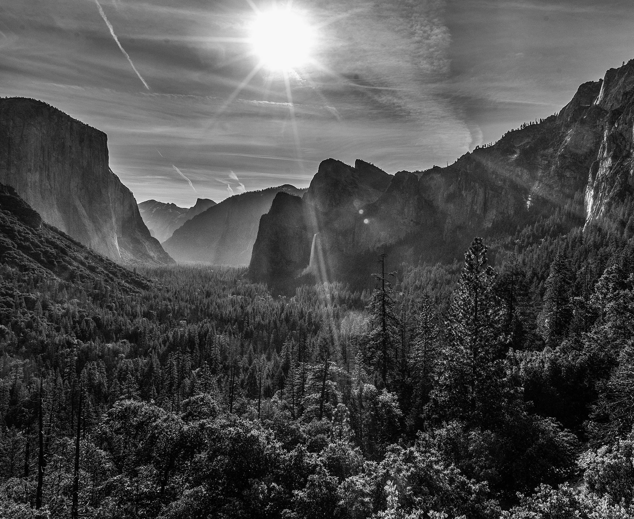 Mick Richards, Burnsville, MN Where were you when you took this photo? What does it show? This is the view you see when you enter or exit Yosemite NP from the west entrance. This vantage point is called Tunnel View and is easy to access. There is a parking lot right when you enter and exit the Park and there's an area that you can stand in that's conducive to taking photos. It's probably the most photographed spot in the park and is a stunning sight when entering or exiting the park. What equipm