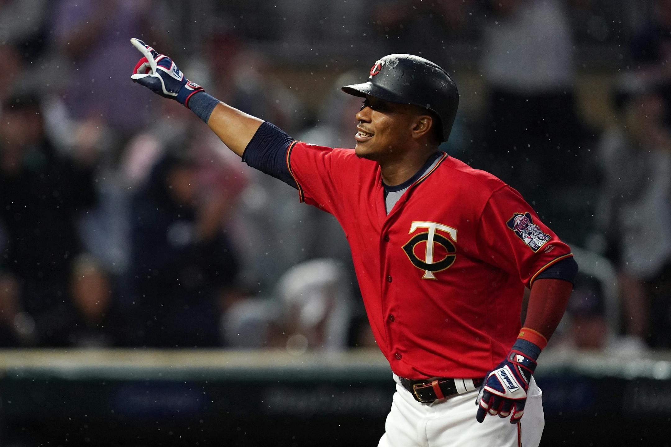 Minnesota Twins shortstop Jorge Polanco (11) celebrated as he crossed home plate after hitting a home run in the second inning.