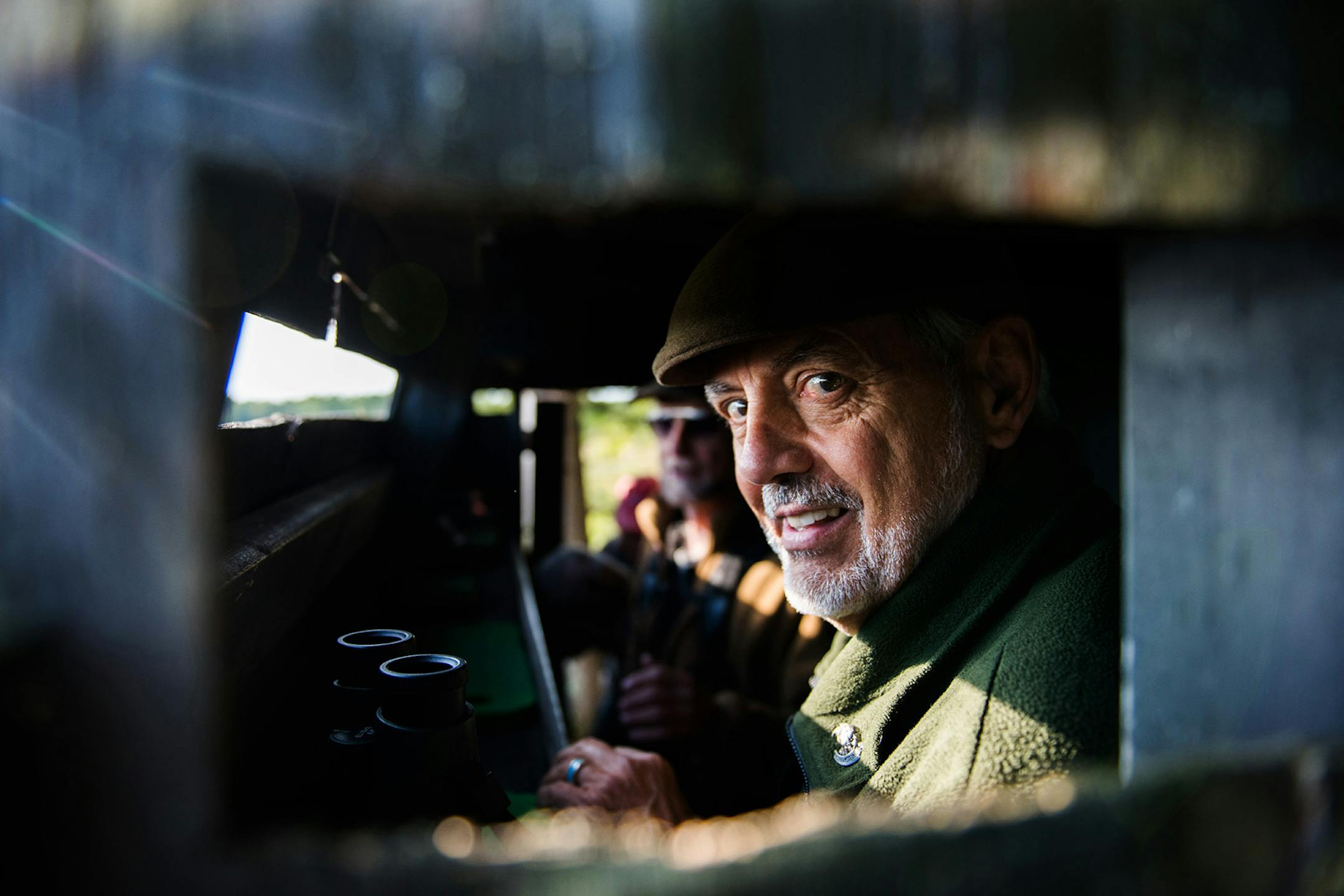 Frank Taylor peers out of his blind. ] MARK VANCLEAVE • mark.vancleave@startribune.com * Frank Taylor and his wife Trudi have been catching, banding and releasing hawks from the same field near Knife River for 48 years. Photographed Sunday, Sept. 10, 2017.