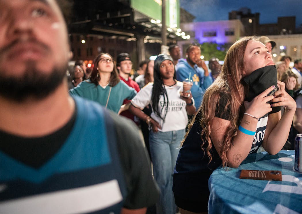 Fans including Andreas Cerquera, left, and Valentina Montoya watched the Timberwolves fall to the Dallas Mavericks at the Wolves Back Block Party.