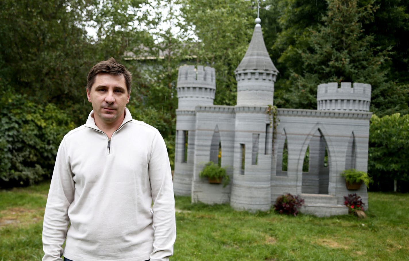 Andrey Rudenko a Shorewood contractor stood by a concrete play castle that was built with the aid of a 3D printer Thursday August 28 , 2014 in Shorewood, MN . ] Jerry Holt Jerry.holt@startribune.com