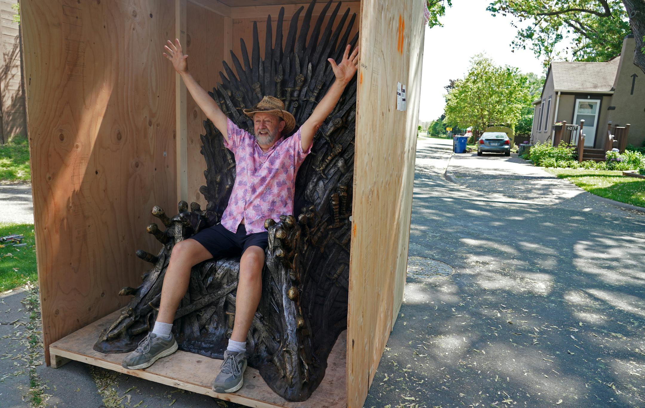 Ken and Gail James, a retired couple who live in Richfield, entered a national contest and won their own life-sized replica version of the Iron Throne from the HBO show, Game of Thrones. Here, Ken jumped into the box to get a seat on the Iron Throne before hauling it to his backyard fire pit where it will find it&#x2019;s permanent home.]
brian.peterson@startribune.com
Richfield, MN Tuesday, June 4, 2019