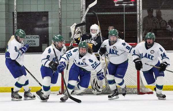 Blake players celebrated the first goal of the Class 1A, Section 5 championship game against Breck.