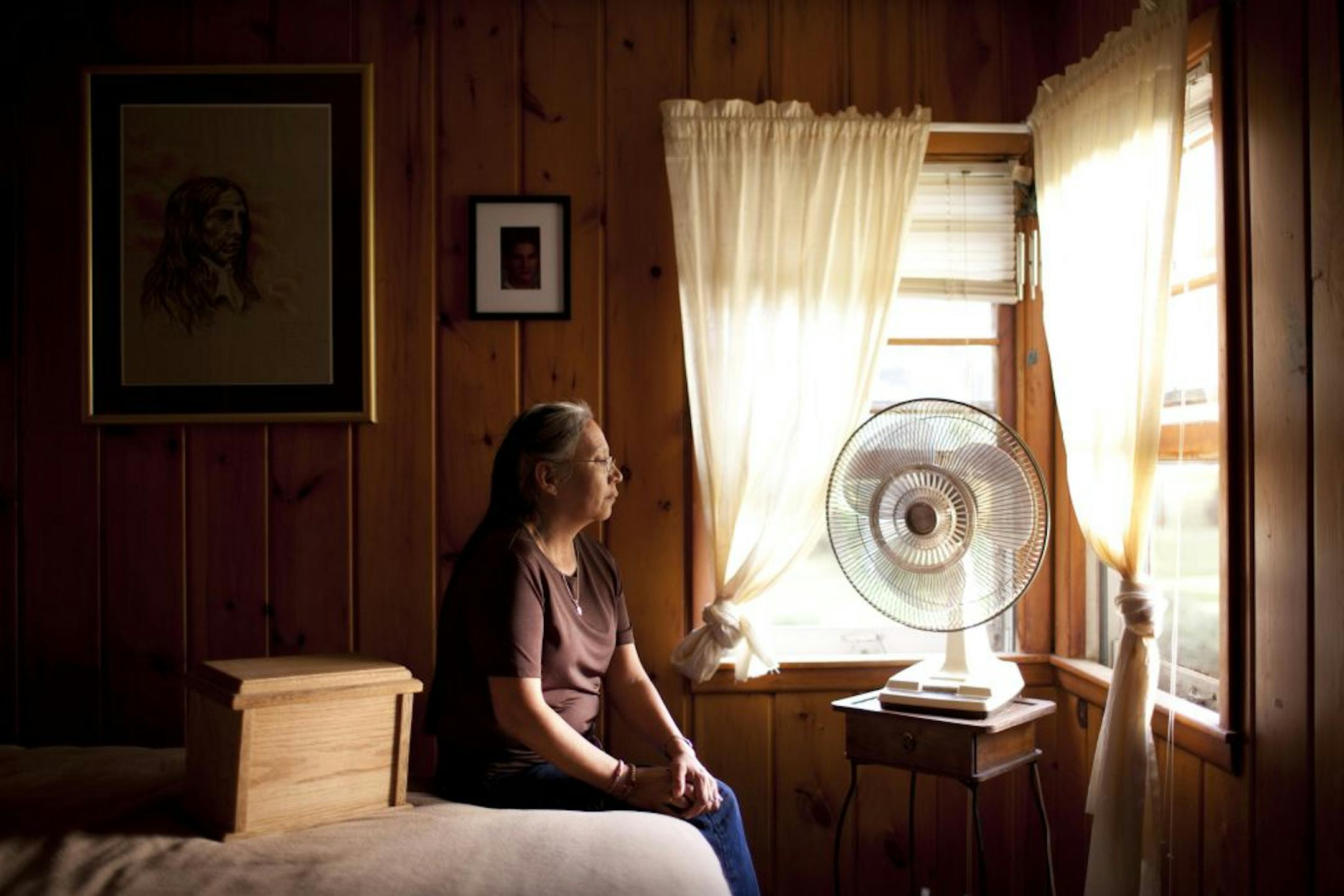 Maria Winkelman, in her Plymouth home with a box containing her son's ashes. Wes suffered severe burns over 20 percent of his body in a care facility's shower.