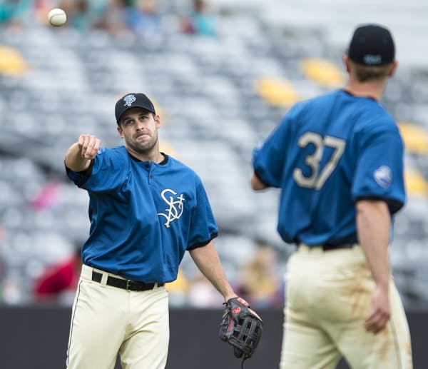 St. Paul Saints infielder Nate Hanson tossed the ball to pitcher Jeff Shields while warming up between innings Wednesday. ] Aaron Lavinsky &#x2022; aa