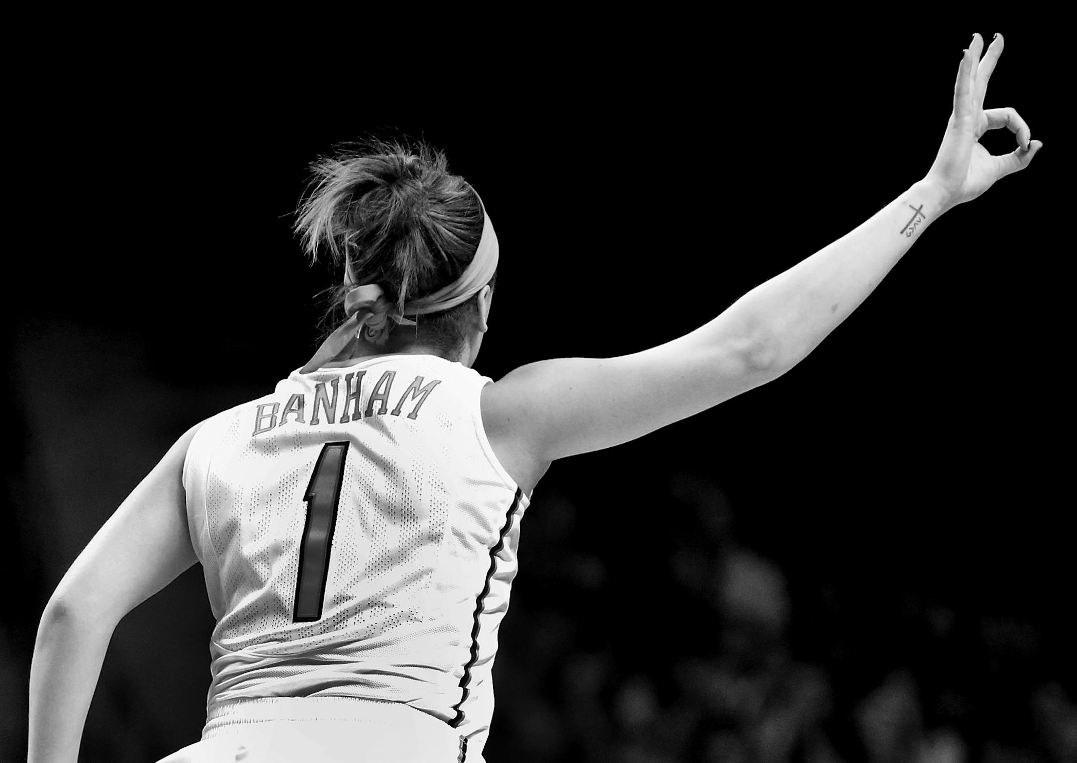 Rachel Banham (1) celebrated after making a three pointer in the third quarter. Minnesota beat Iowa by a final score of 78-76. Banham finished with 35 points.